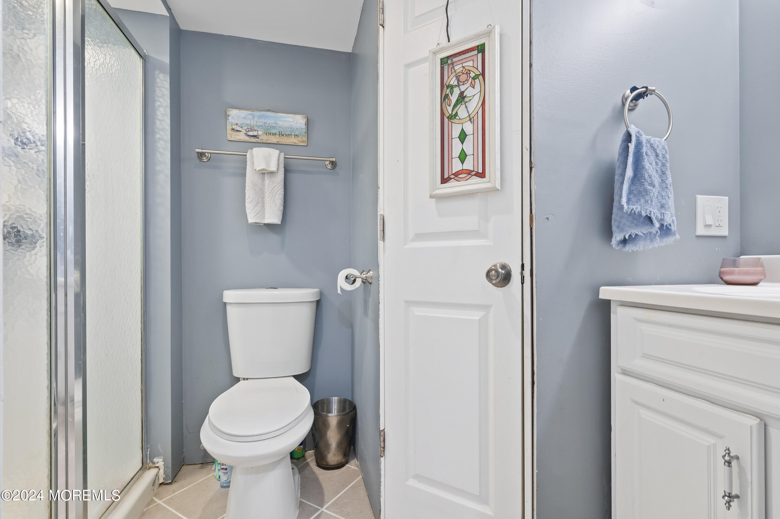 114 Andrew Lane Brick, NJ 08724 - Photo 30 of 54 a white toilet sitting next to a bathroom sink