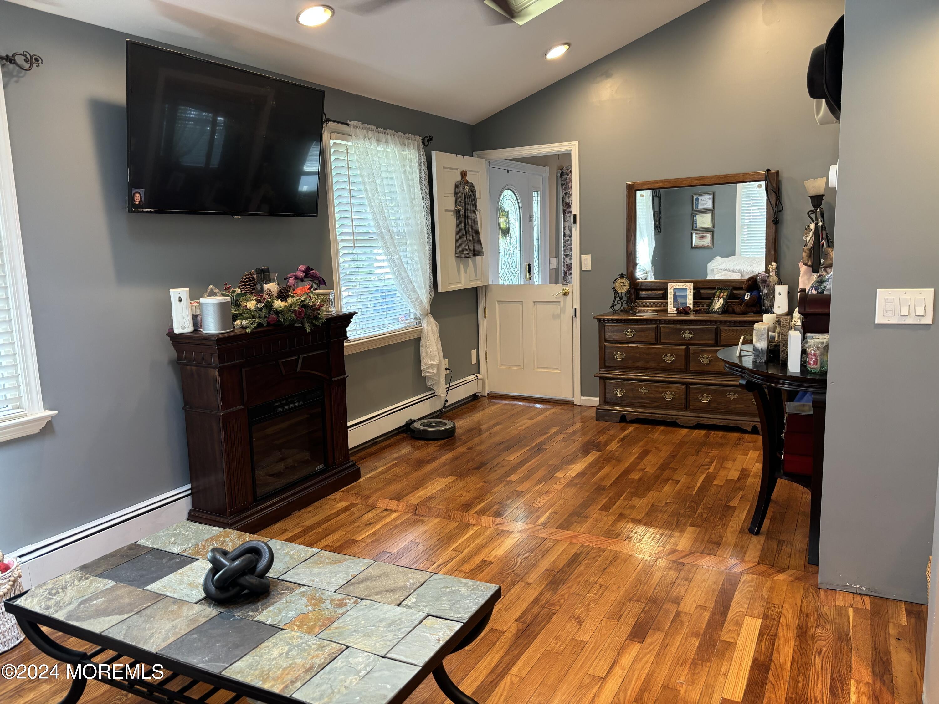 114 Andrew Lane Brick, NJ 08724 - Photo 3 of 54 a room with furniture and a flat screen tv