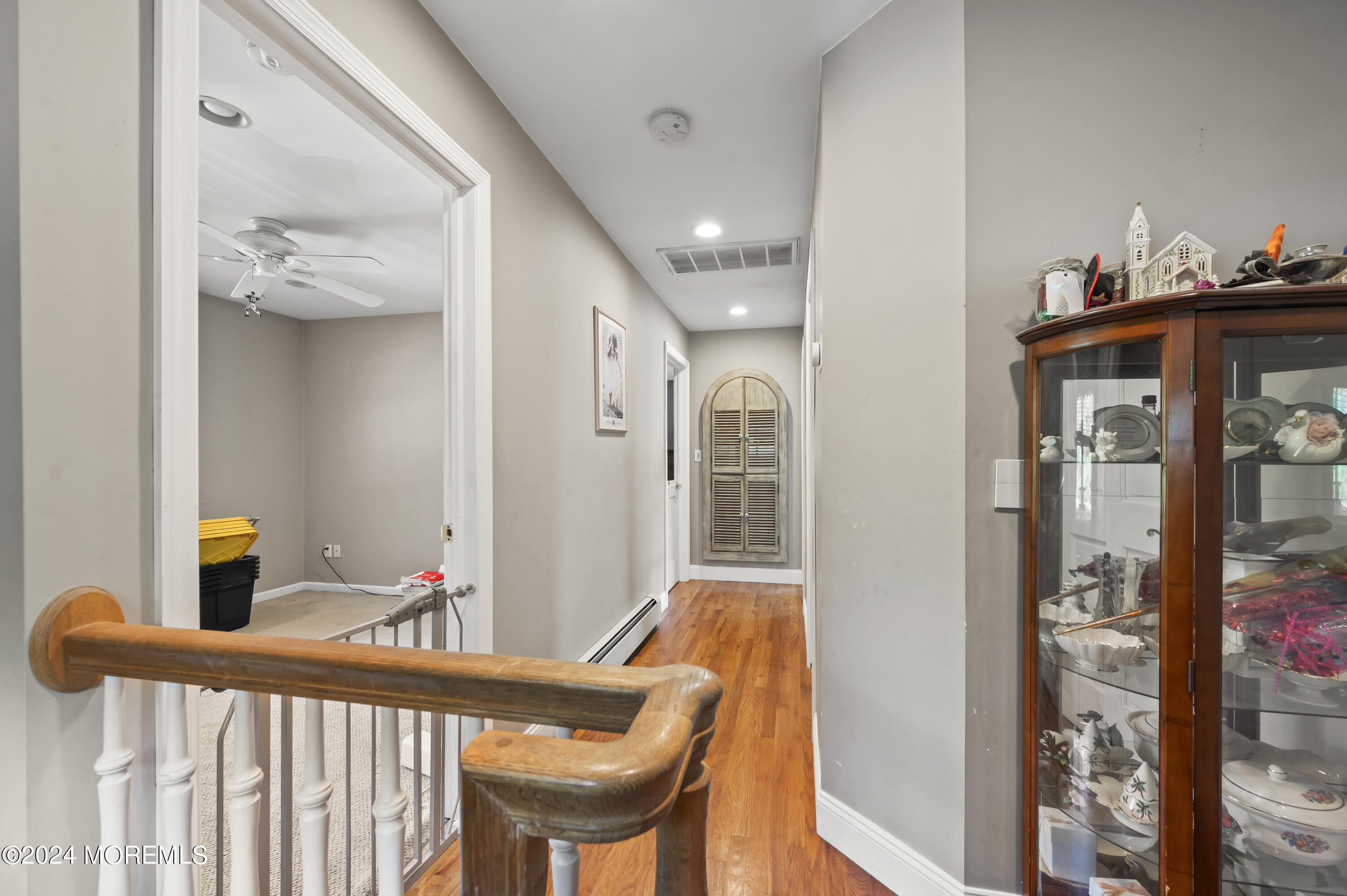 114 Andrew Lane Brick, NJ 08724 - Photo 33 of 54 a view of a hallway to a livingroom with furniture