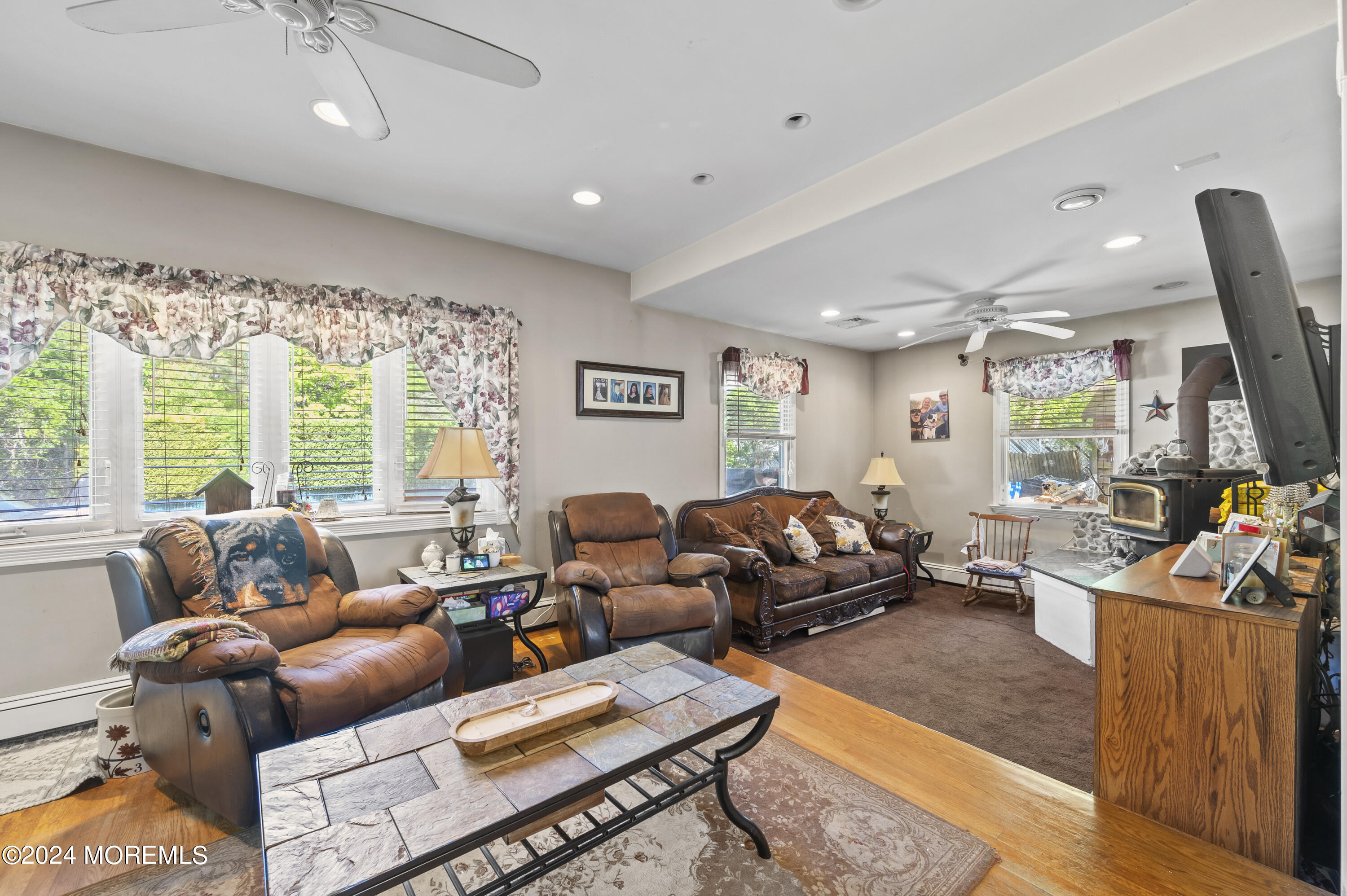 114 Andrew Lane Brick, NJ 08724 - Photo 40 of 54 a living room with furniture a large window and a rug