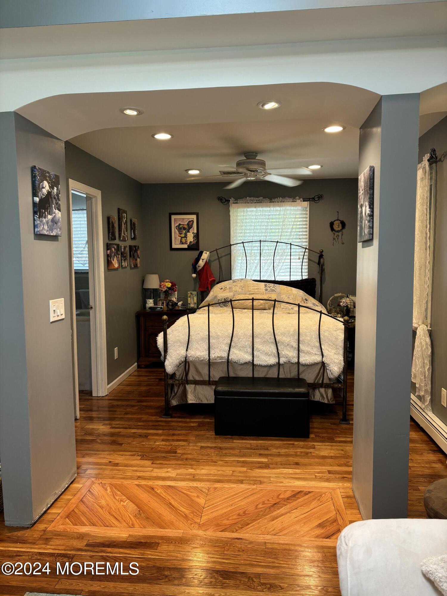 114 Andrew Lane Brick, NJ 08724 - Photo 4 of 54 a bedroom with furniture and a mirror