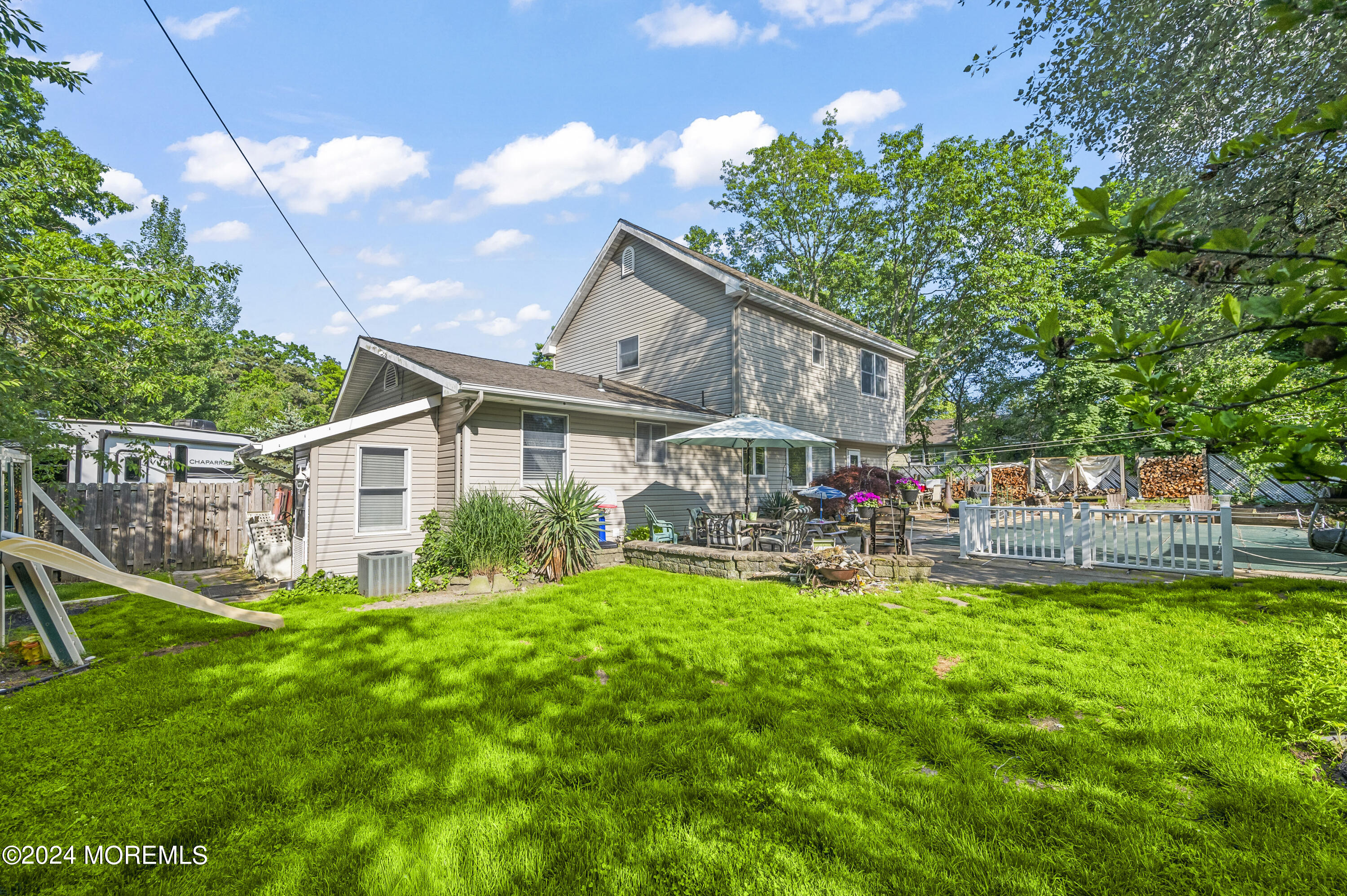 114 Andrew Lane Brick, NJ 08724 - Photo 45 of 54 a view of a house with a yard and sitting area