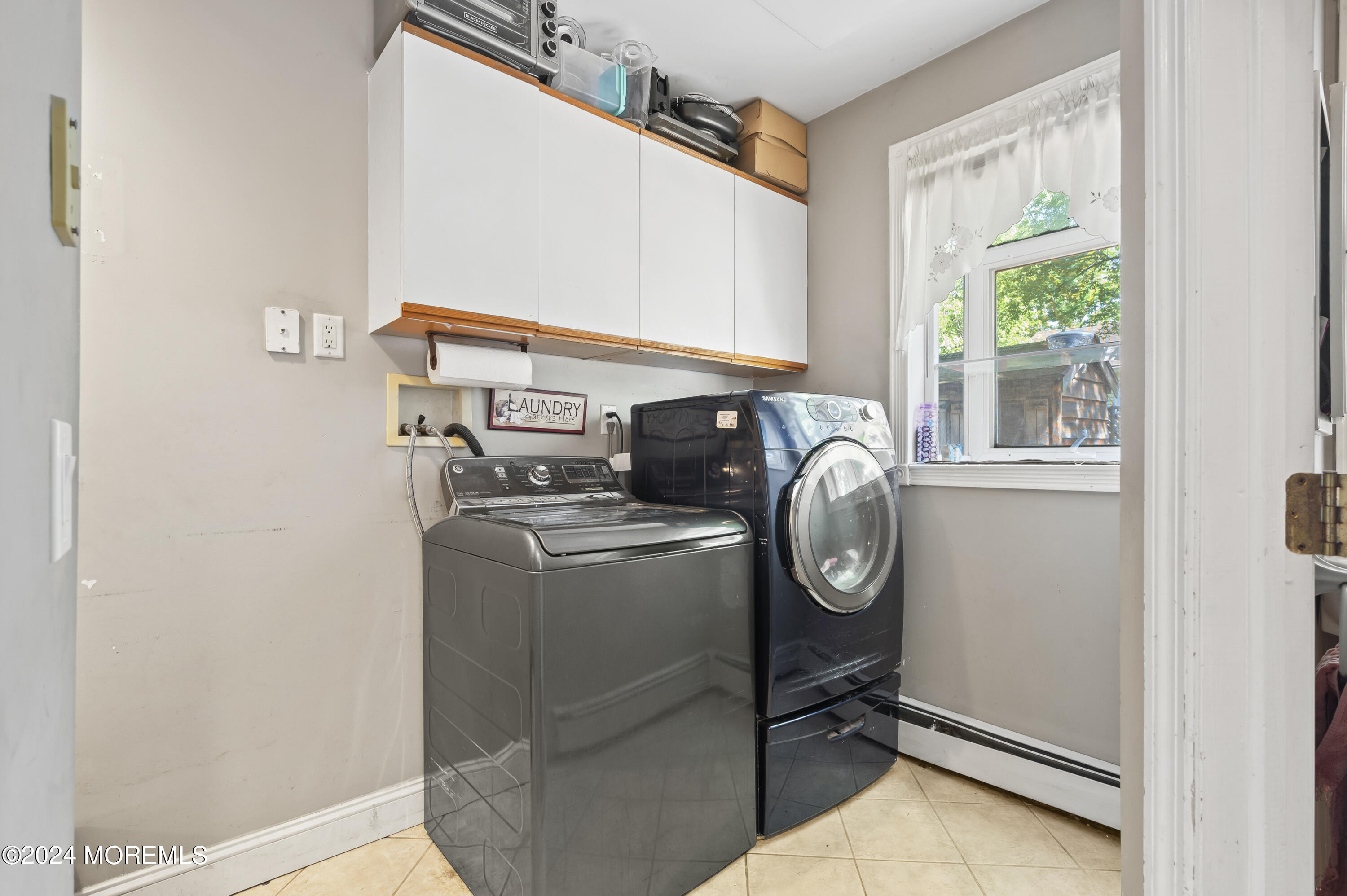 114 Andrew Lane Brick, NJ 08724 - Photo 51 of 54 a view of storage and utility room with washer and dryer