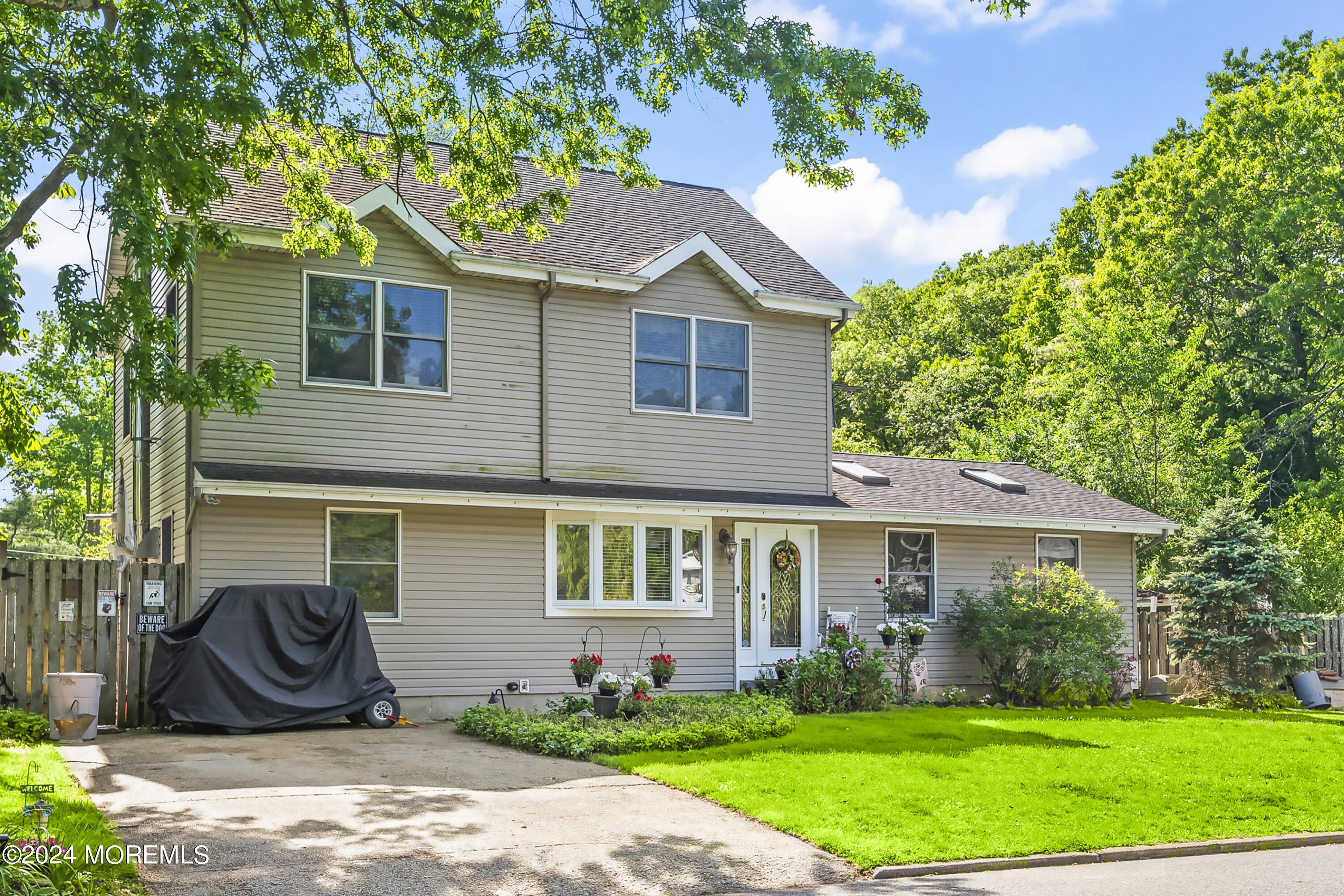 114 Andrew Lane Brick, NJ 08724 - Photo 54 of 54 a front view of a house with a yard and trees
