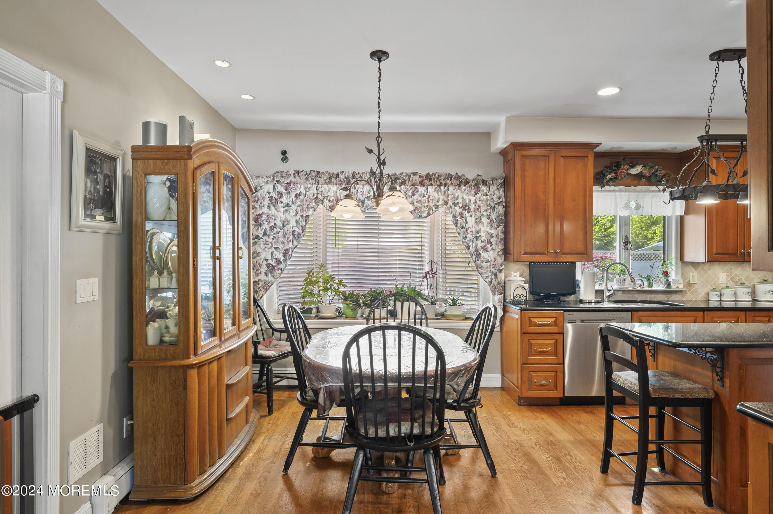 114 Andrew Lane Brick, NJ 08724 - Photo 7 of 54 a dining room with furniture a chandelier and wooden floor