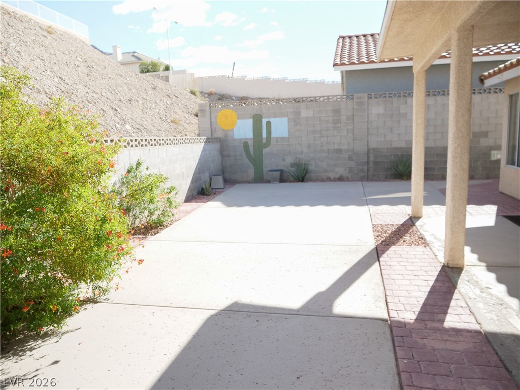 1920 Racine Drive Las Vegas, NV 89156 - Photo 16 of 16 Enjoy the spacious covered patio, fully fenced backyard with concrete flooring and beautiful plants.