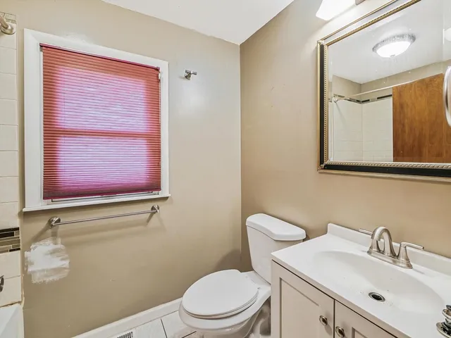 a bathroom with a shower and a window