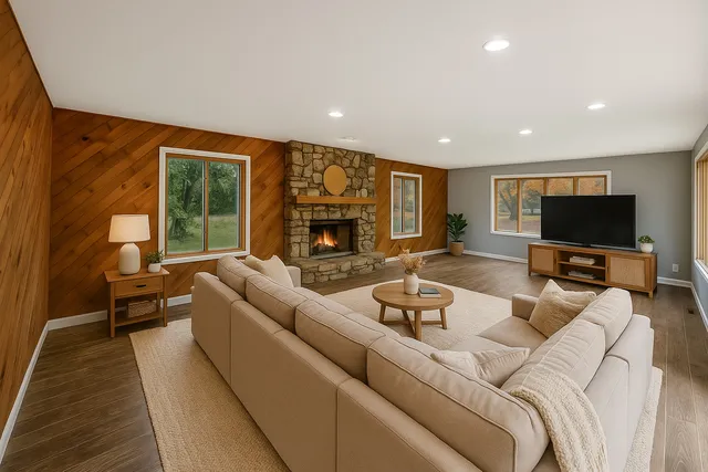 a living room with furniture and a flat screen tv