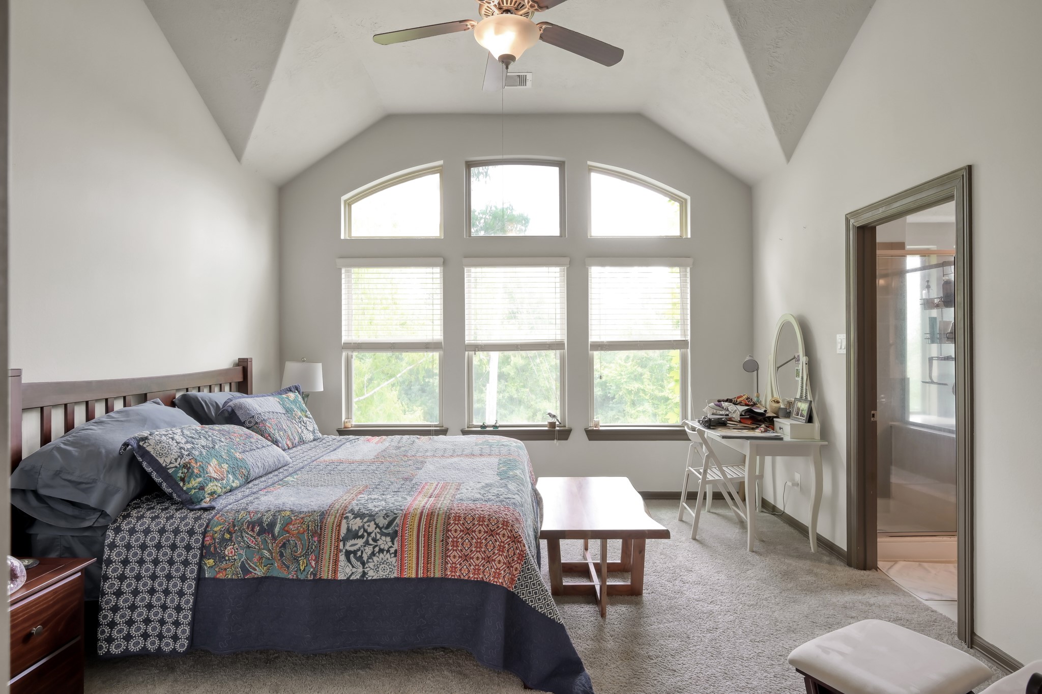 18 Aventura Place Spring, TX 77389 - Photo 22 of 43 a bedroom with a bed and a chandelier