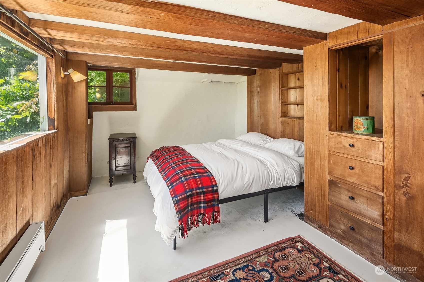 11814 Southwest Dolphin Point Road Vashon, WA 98070 - Photo 17 of 31 a bedroom with a bed and dresser