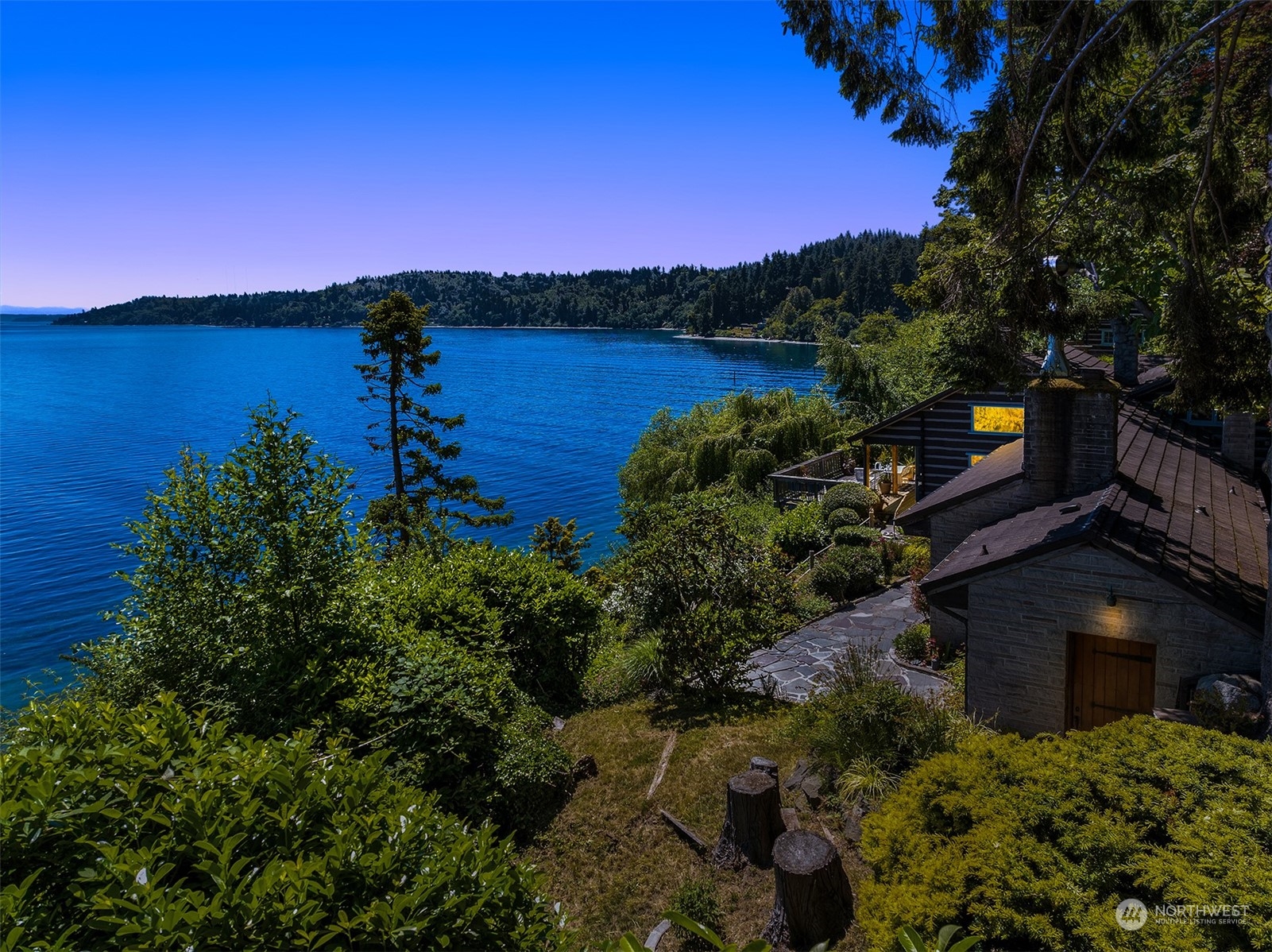 11814 Southwest Dolphin Point Road Vashon, WA 98070 - Photo 28 of 31 a view of a lake with a mountain in the background