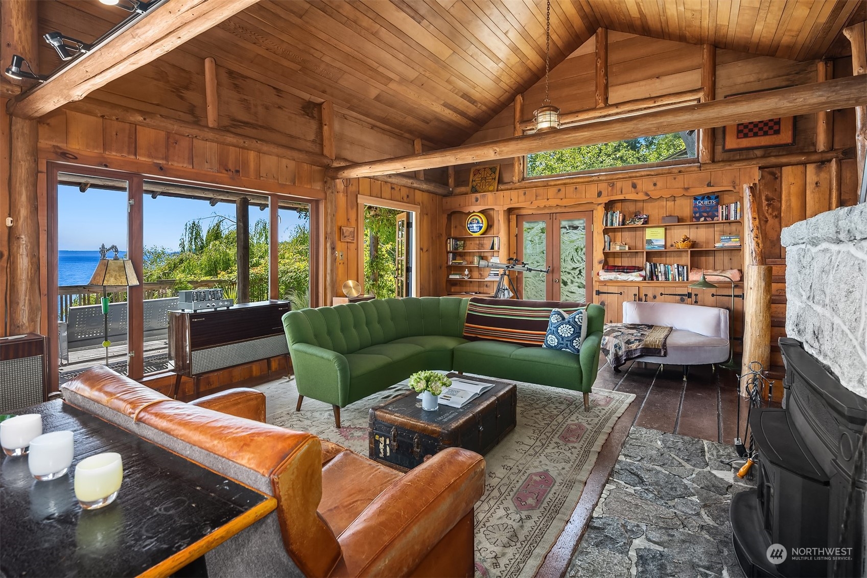 11814 Southwest Dolphin Point Road Vashon, WA 98070 - Photo 7 of 31 a living room with furniture and a floor to ceiling window
