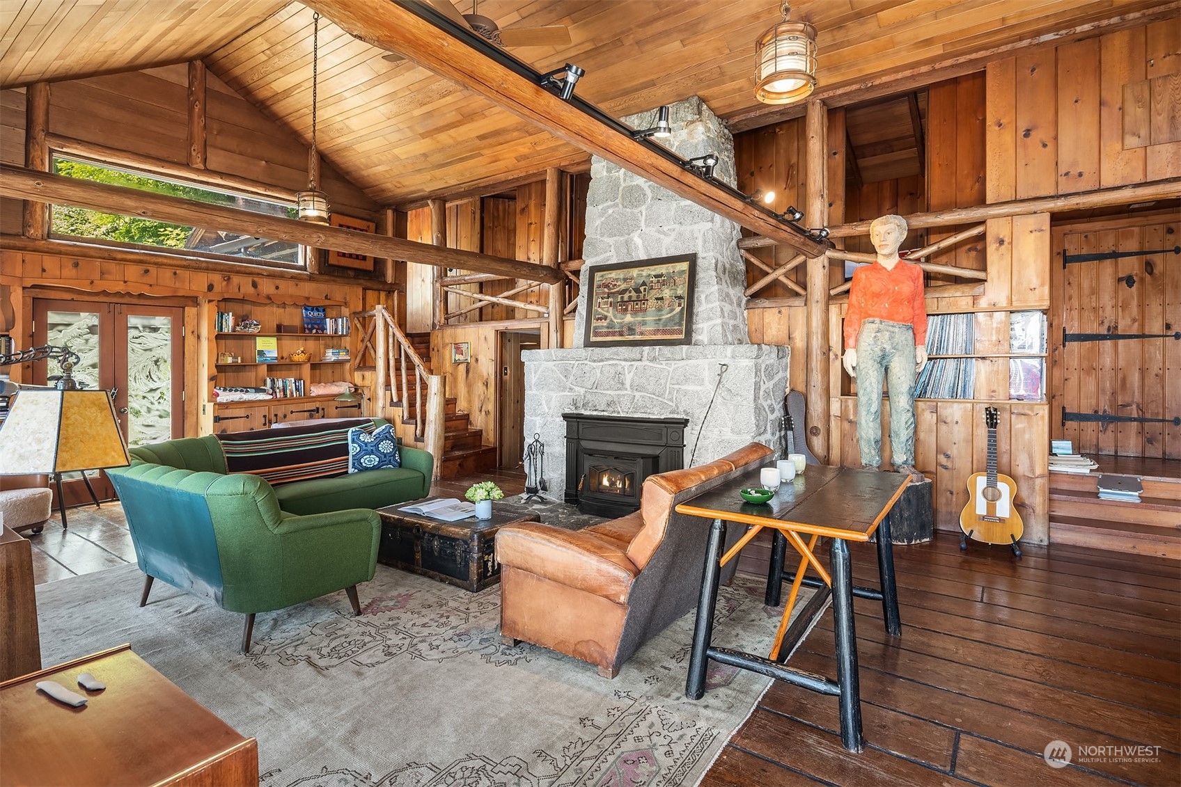 11814 Southwest Dolphin Point Road Vashon, WA 98070 - Photo 8 of 31 a backyard of a house with sofas table and chairs