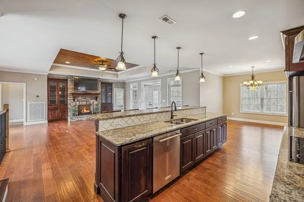 a kitchen with wooden cabinets and a stove top oven