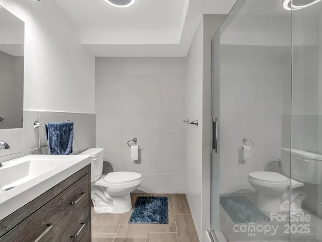 a bathroom with a toilet a sink and a bathtub