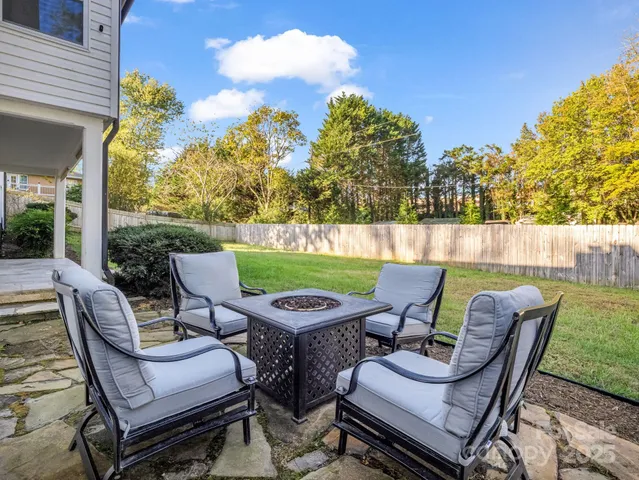 a view of a patio with couple of chairs