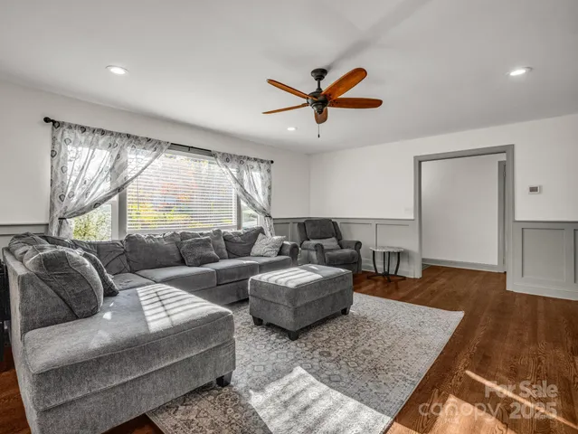 a living room with furniture and a rug