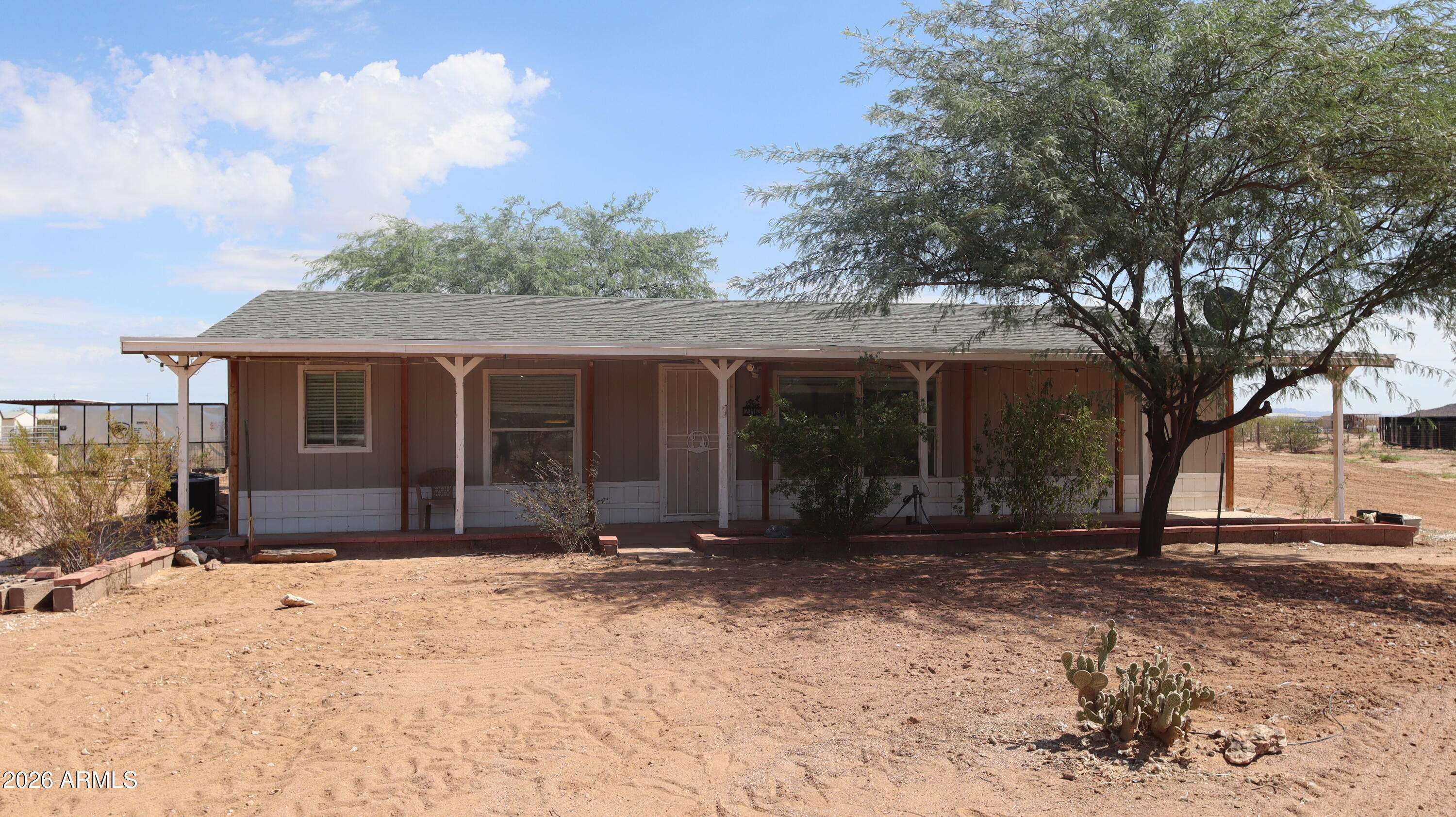20163 North Sage Street Maricopa, AZ 85139 - Photo 2 of 54 a front view of a house with a yard
