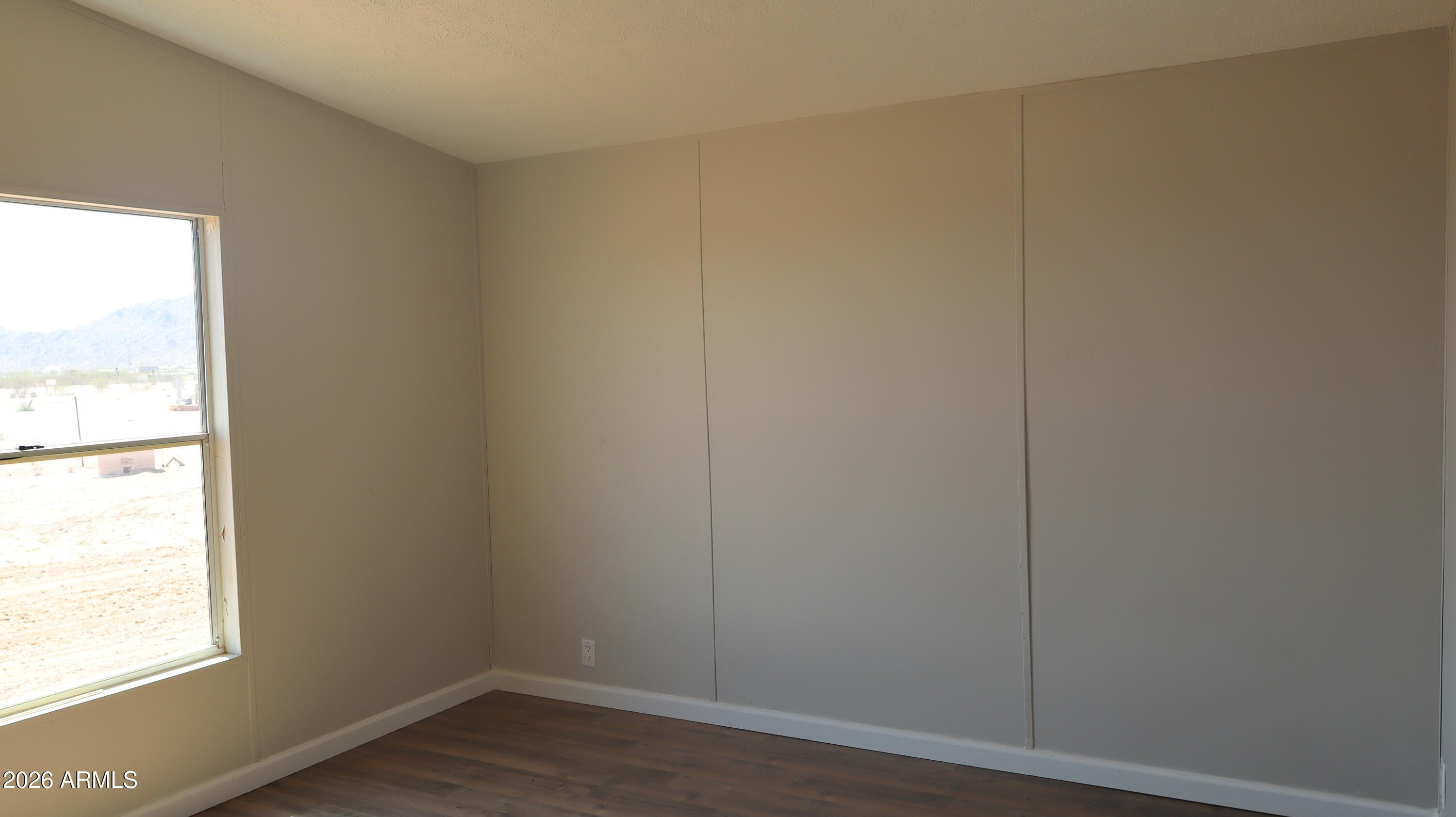 20163 North Sage Street Maricopa, AZ 85139 - Photo 21 of 54 a view of an empty room and window