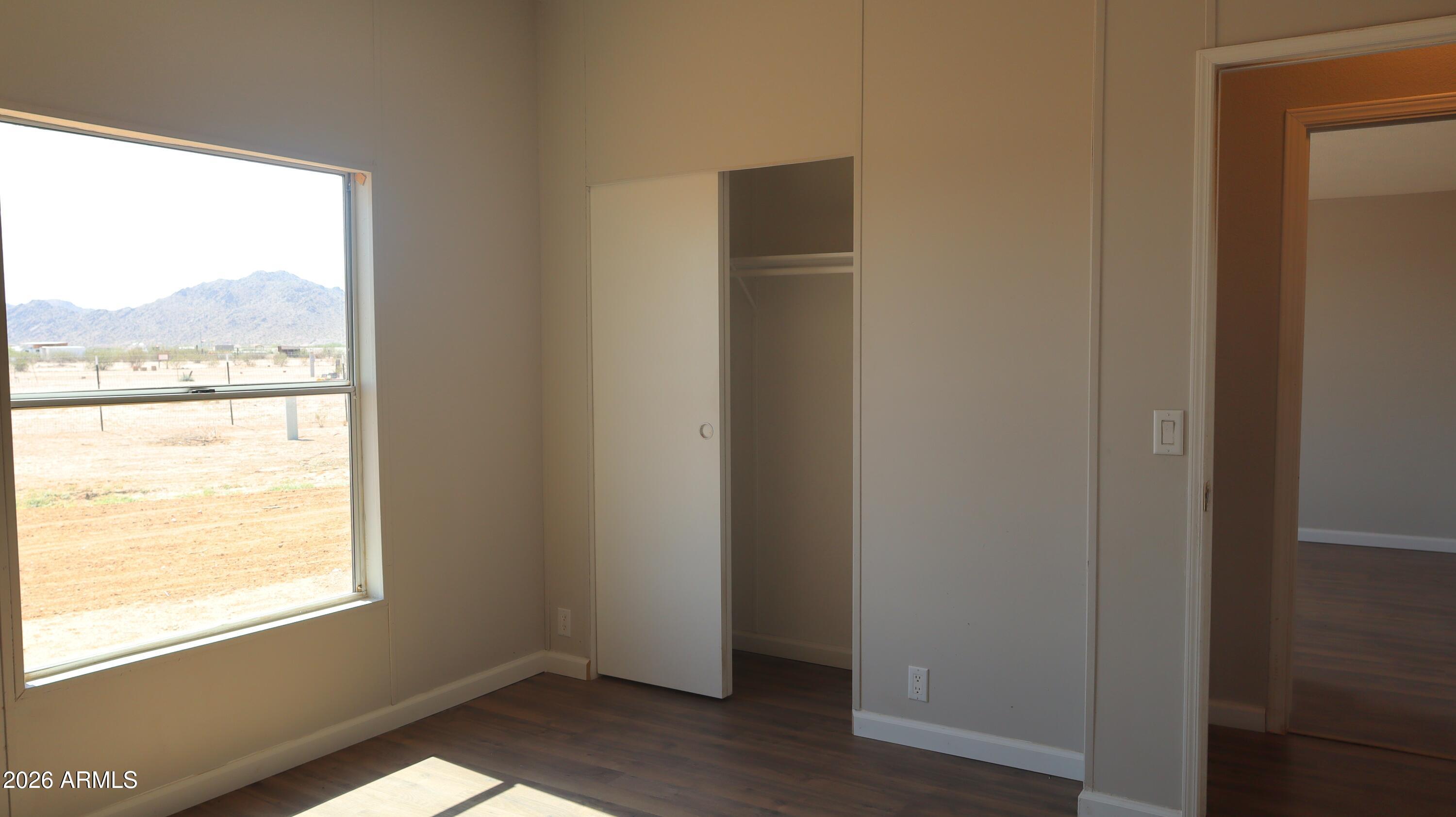 20163 North Sage Street Maricopa, AZ 85139 - Photo 22 of 54 a view of an empty room and a window