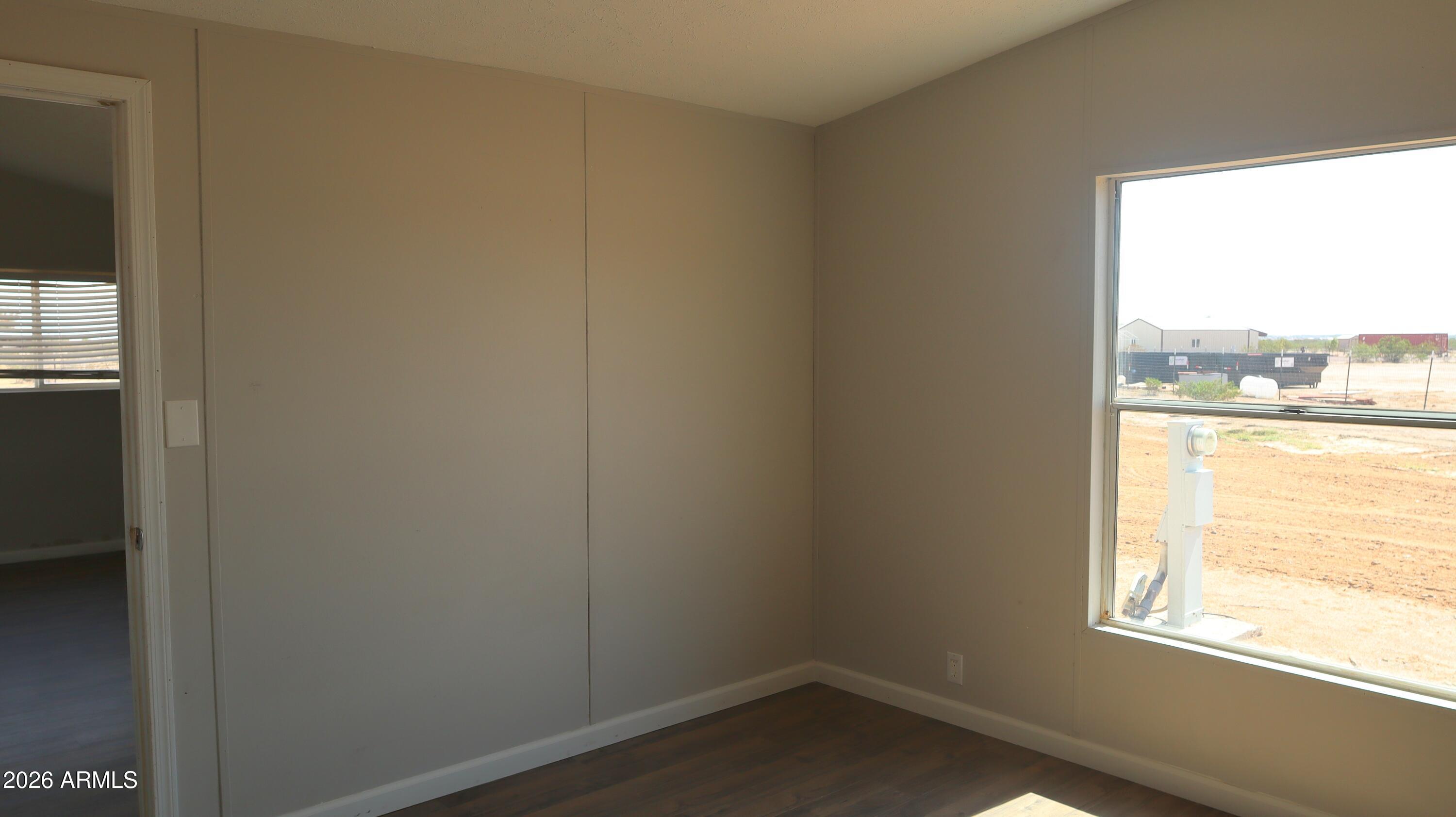 20163 North Sage Street Maricopa, AZ 85139 - Photo 23 of 54 an empty room with a window