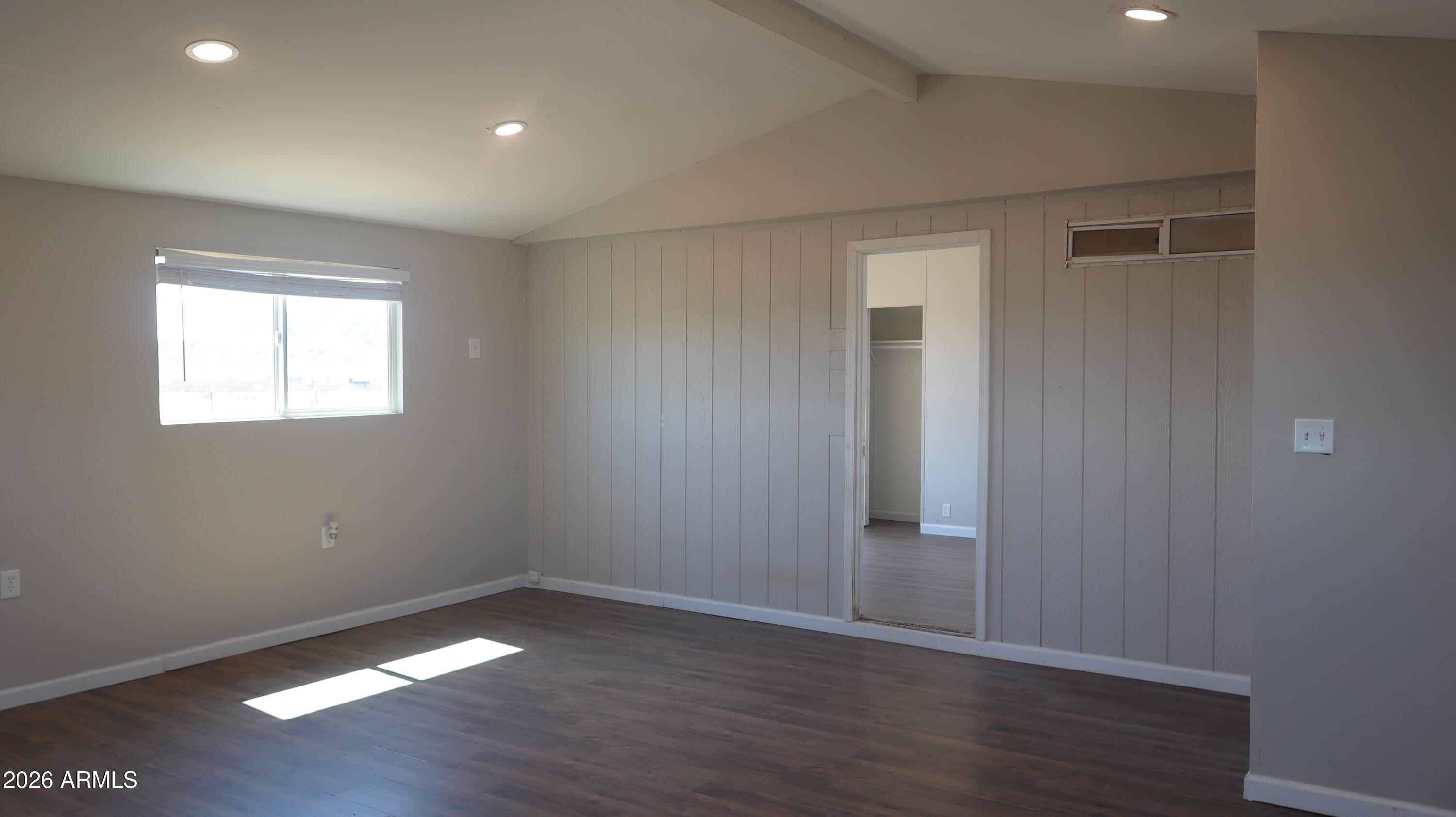 20163 North Sage Street Maricopa, AZ 85139 - Photo 24 of 54 an empty room with wooden floor and windows