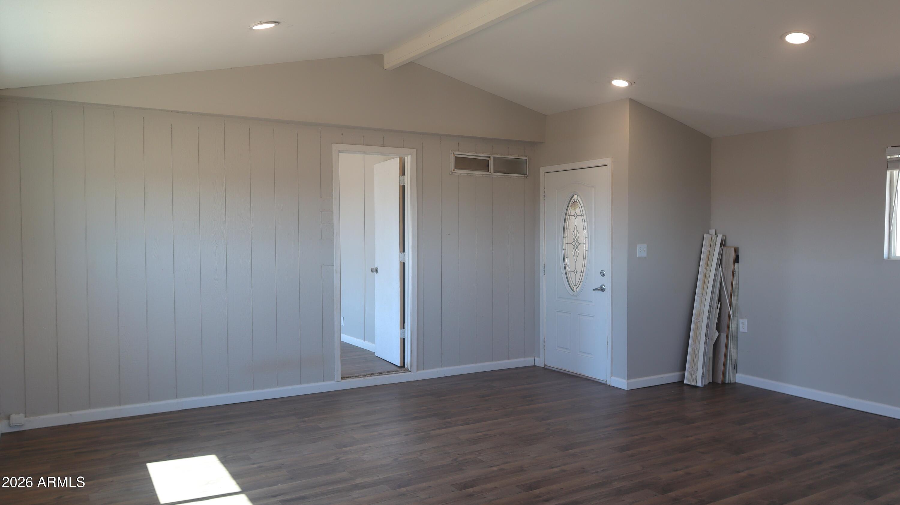 20163 North Sage Street Maricopa, AZ 85139 - Photo 25 of 54 a view of an empty room with wooden floor