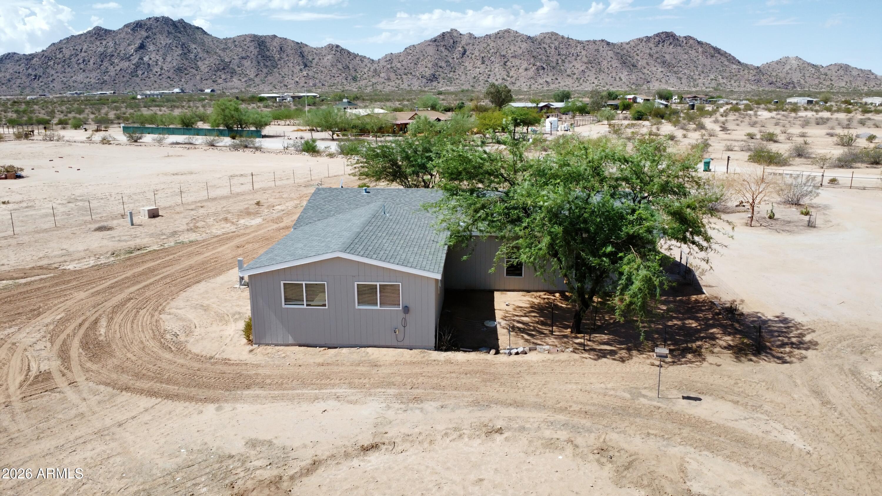 20163 North Sage Street Maricopa, AZ 85139 - Photo 37 of 54 a view of a house with a mountain yard