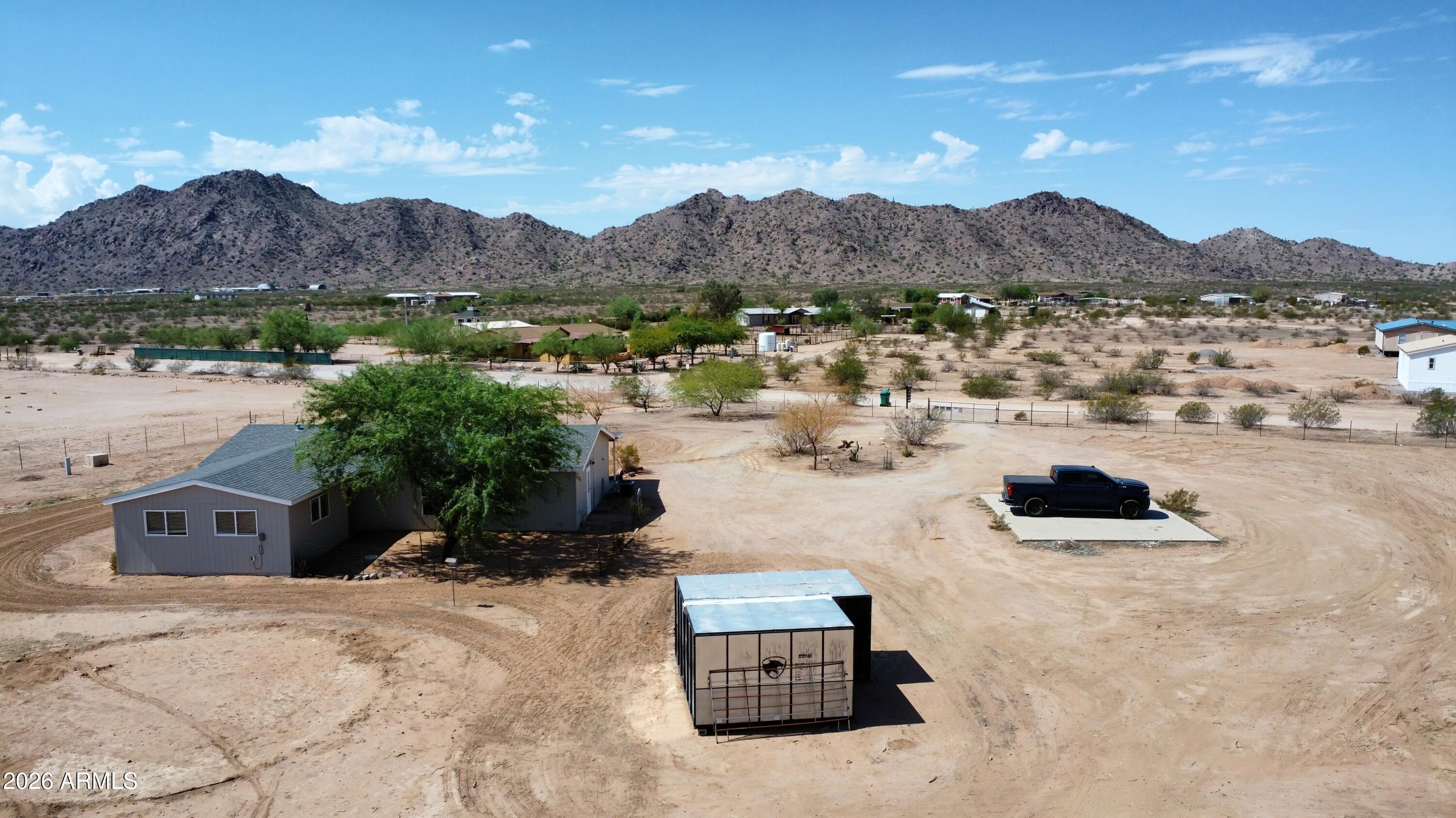 20163 North Sage Street Maricopa, AZ 85139 - Photo 42 of 54 a view of a lake with a mountain