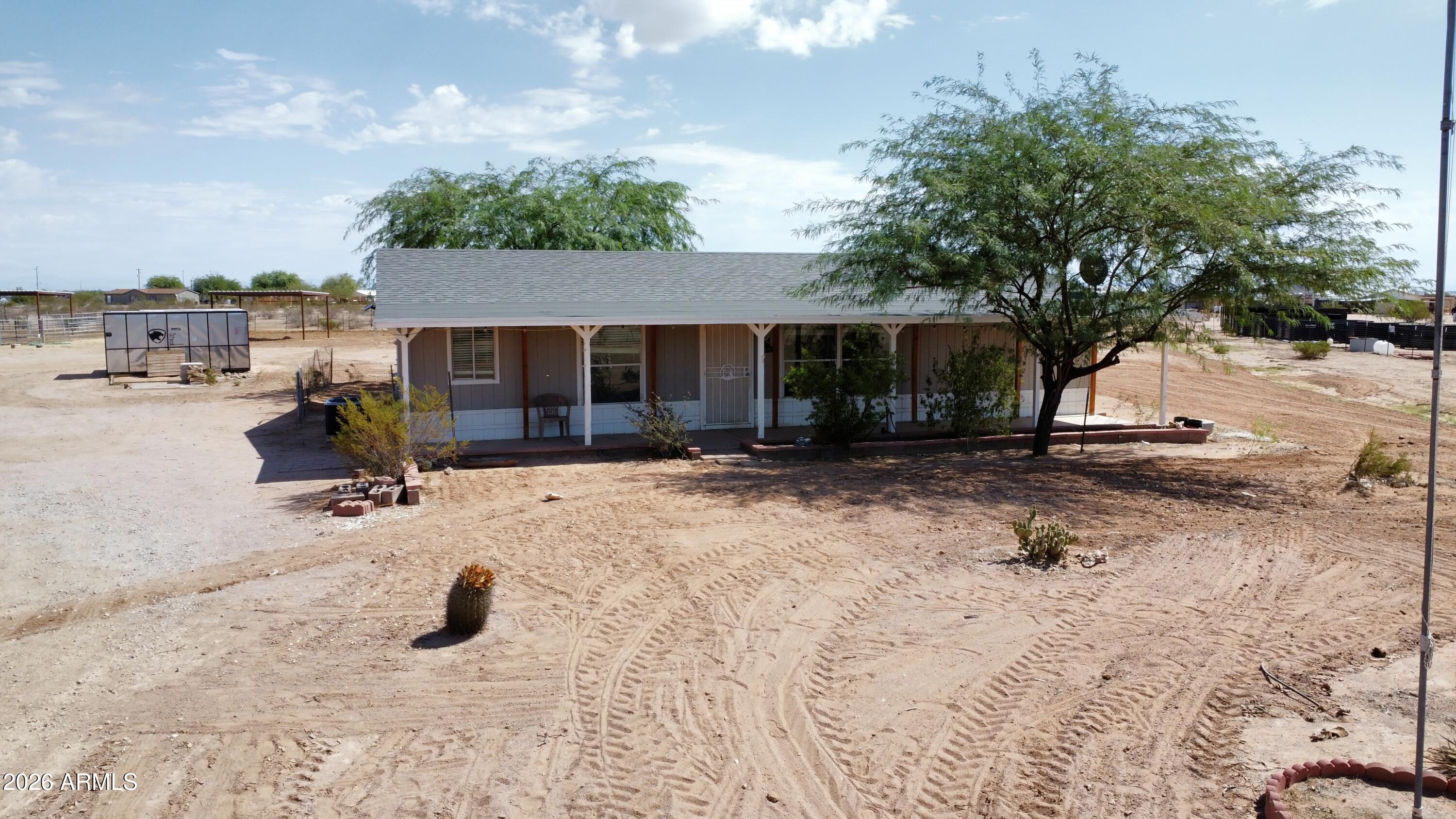 20163 North Sage Street Maricopa, AZ 85139 - Photo 47 of 54 a view of a house with backyard and trees
