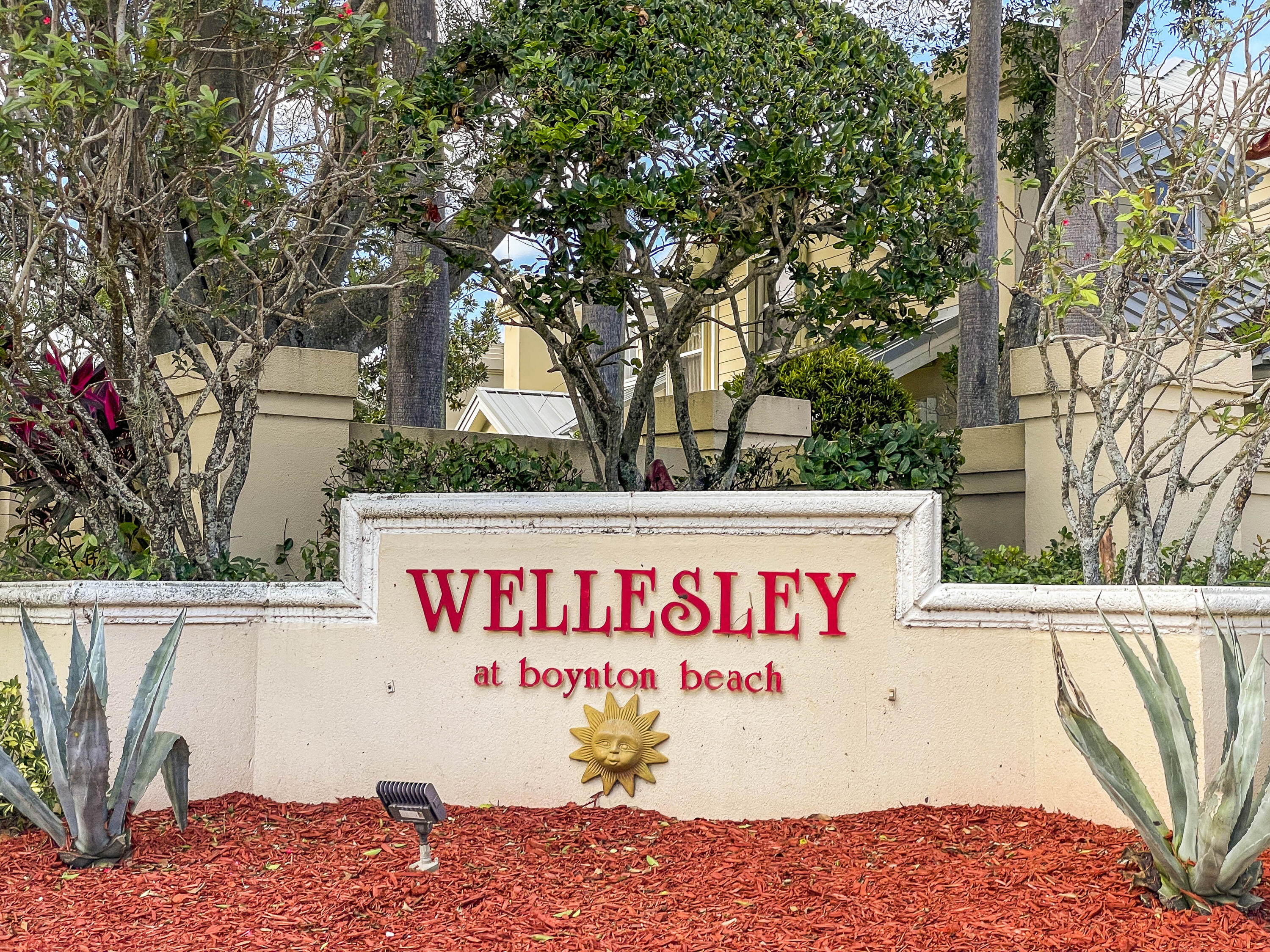 4603 Roxbury Court Boynton Beach, FL 33436 - Photo 19 of 19 a sign on the side of a building