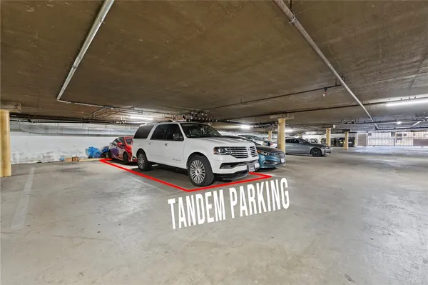 a view of parking space with parked cars