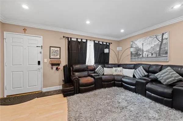 a living room with furniture and a rug