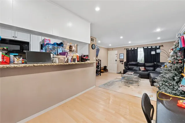 a view of living room with furniture and a flat screen tv