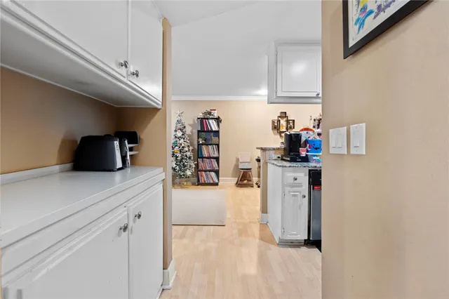 a kitchen with a refrigerator and cabinets