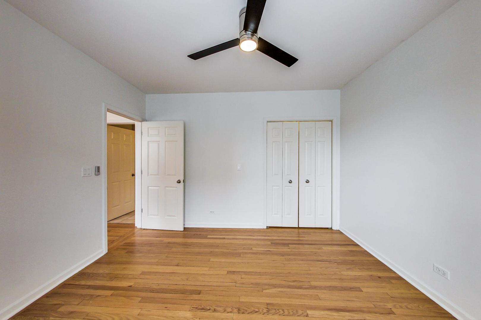 4017 North Troy Street, Unit 2W Chicago, IL 60618 - Photo 12 of 18 a view of empty room with wooden floor