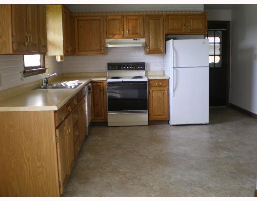 1405 Mission Road Latrobe, PA 15650 - Photo 3 of 8 Kitchen. Nice cabinets, new vinyl floor, dishwasher, refrigerator and electric stove