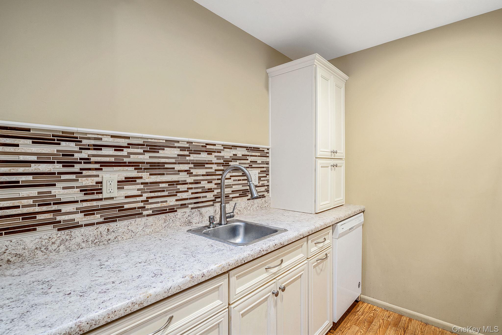 116 B Exmore Court Ridge, NY 11961 - Photo 12 of 19 a close view of sink and tap