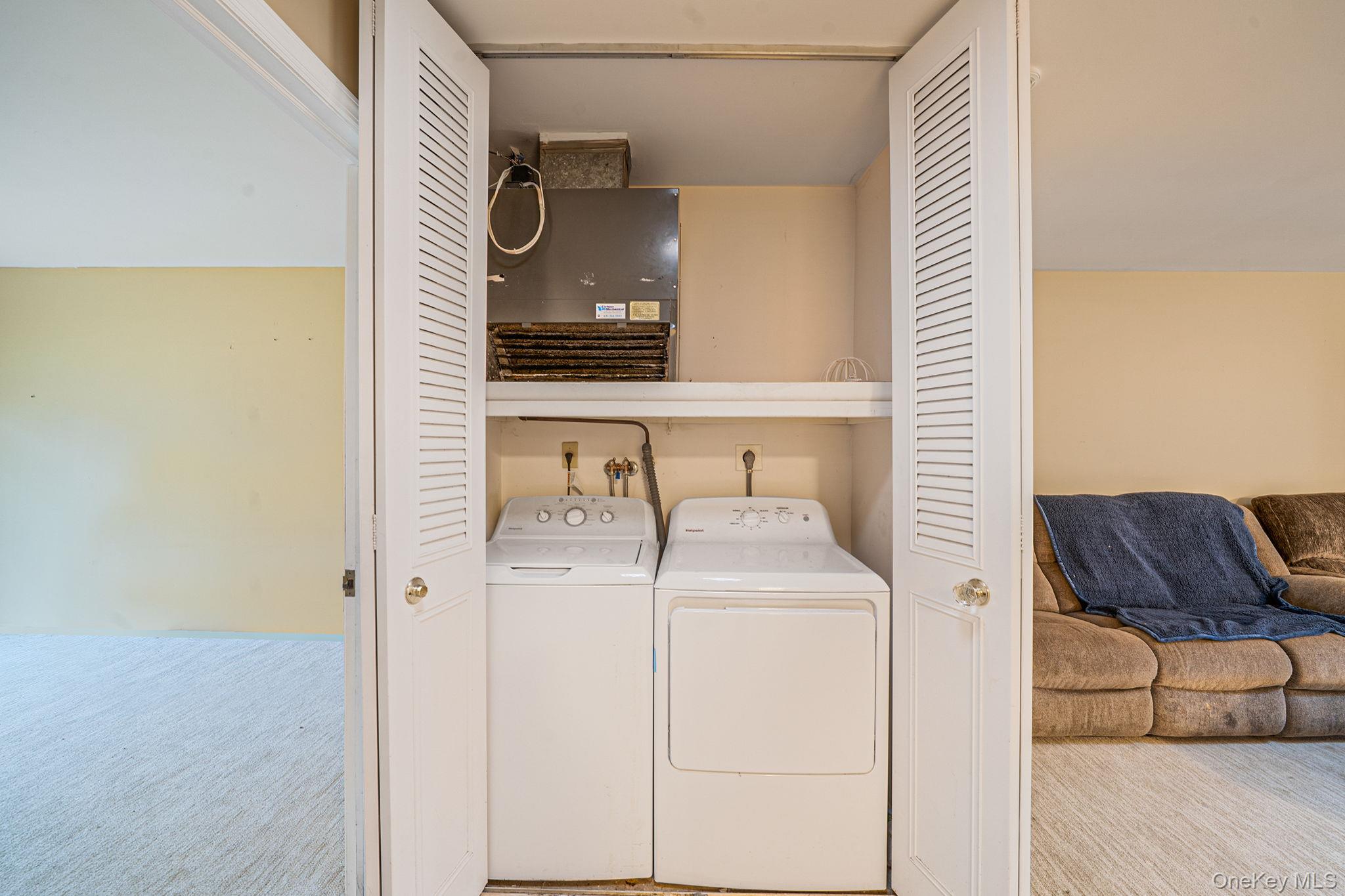 116 B Exmore Court Ridge, NY 11961 - Photo 13 of 19 a bathroom with a sink and a mirror
