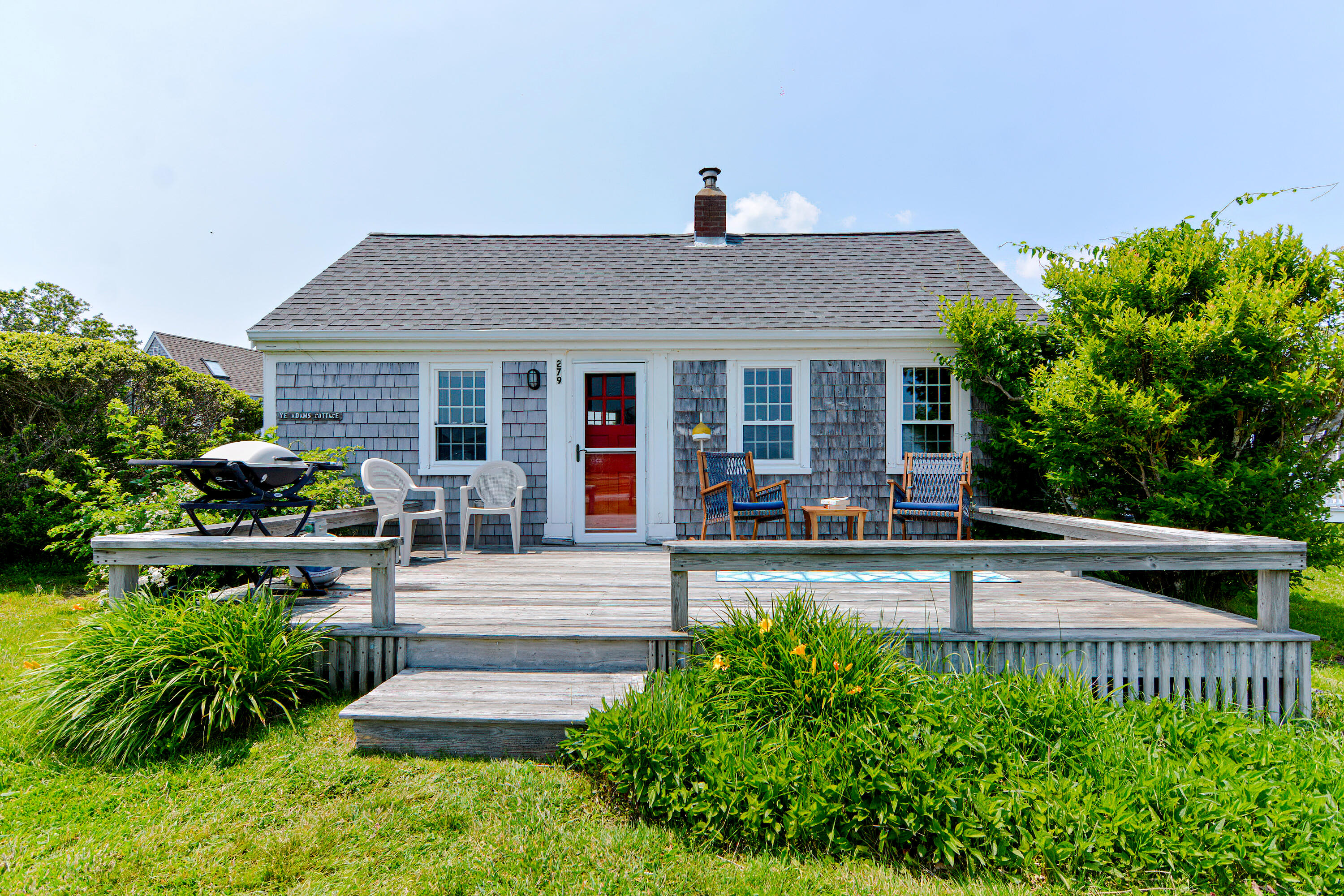 279 Harbor Point Road, Unit 12 Cummaquid, MA 02675 - Photo 1 of 35 a view of a house with sitting area and garden