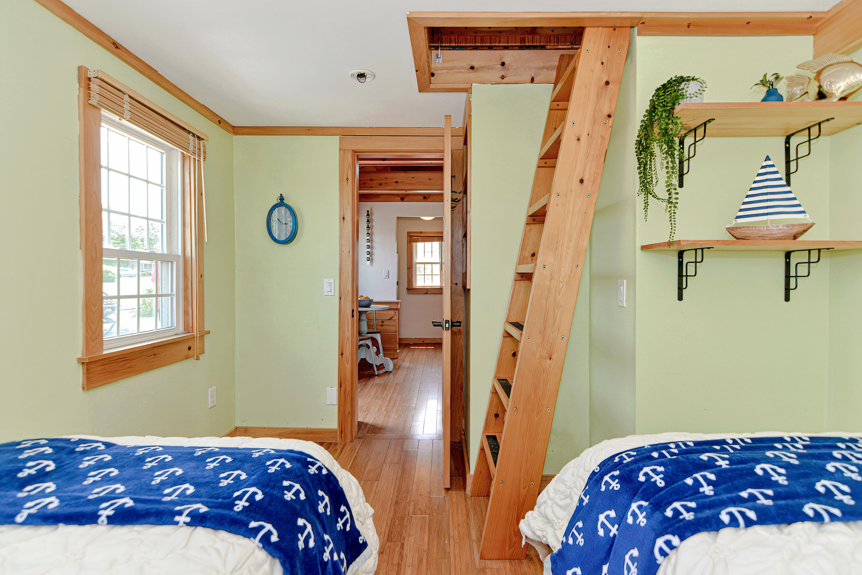 279 Harbor Point Road, Unit 12 Cummaquid, MA 02675 - Photo 14 of 35 a bedroom with a bed and a wooden floor