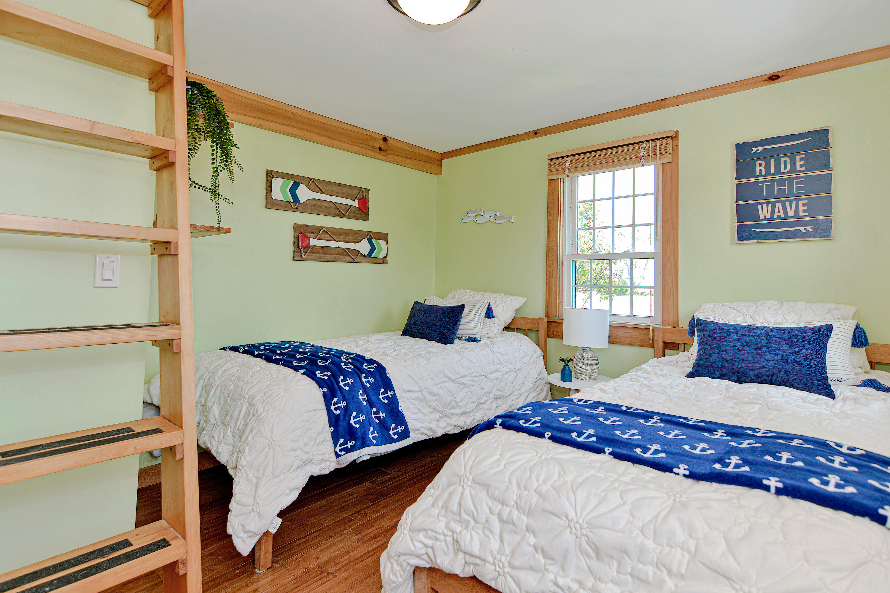 279 Harbor Point Road, Unit 12 Cummaquid, MA 02675 - Photo 15 of 35 a bedroom with two beds and a window