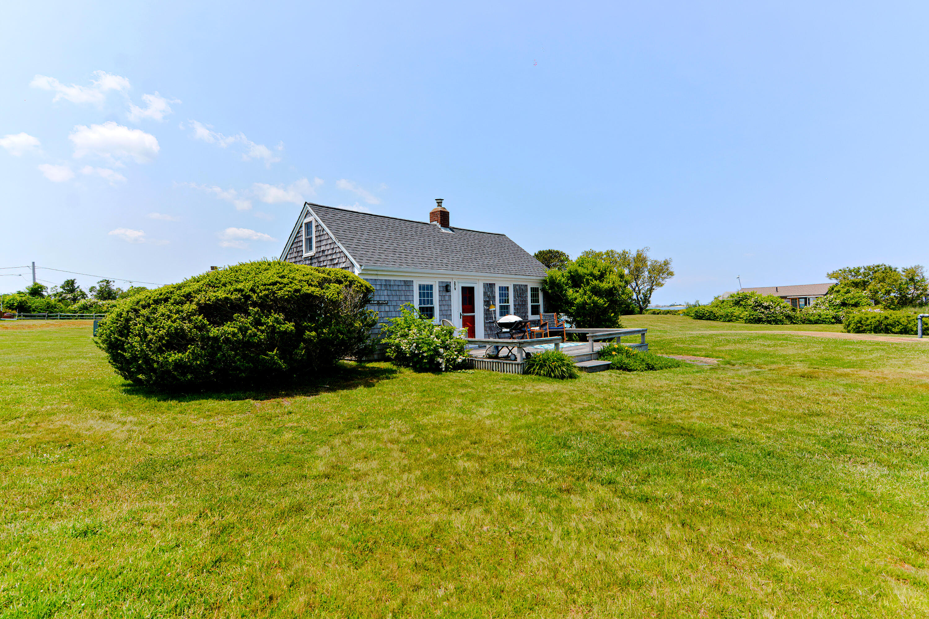 279 Harbor Point Road, Unit 12 Cummaquid, MA 02675 - Photo 19 of 35 a front view of a house with garden