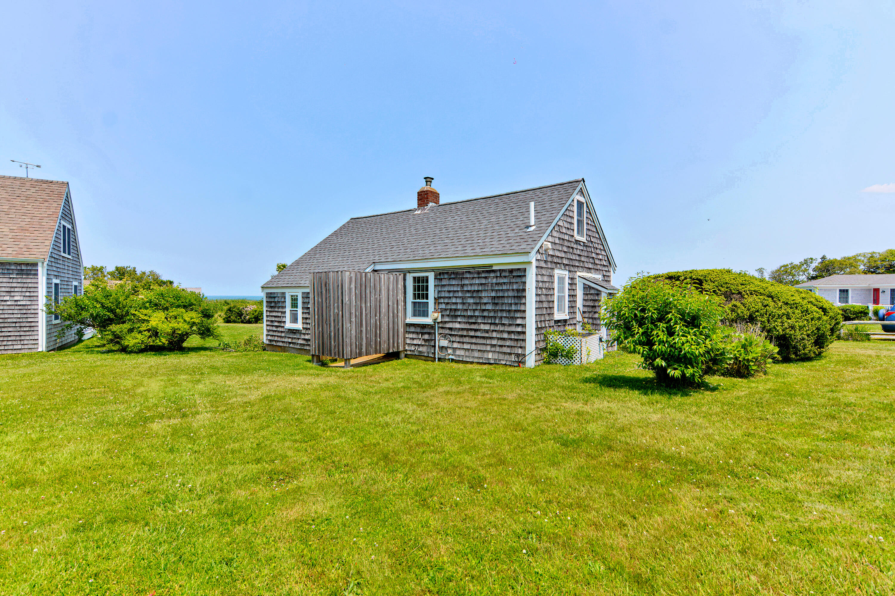 279 Harbor Point Road, Unit 12 Cummaquid, MA 02675 - Photo 21 of 35 a view of a house with backyard and garden