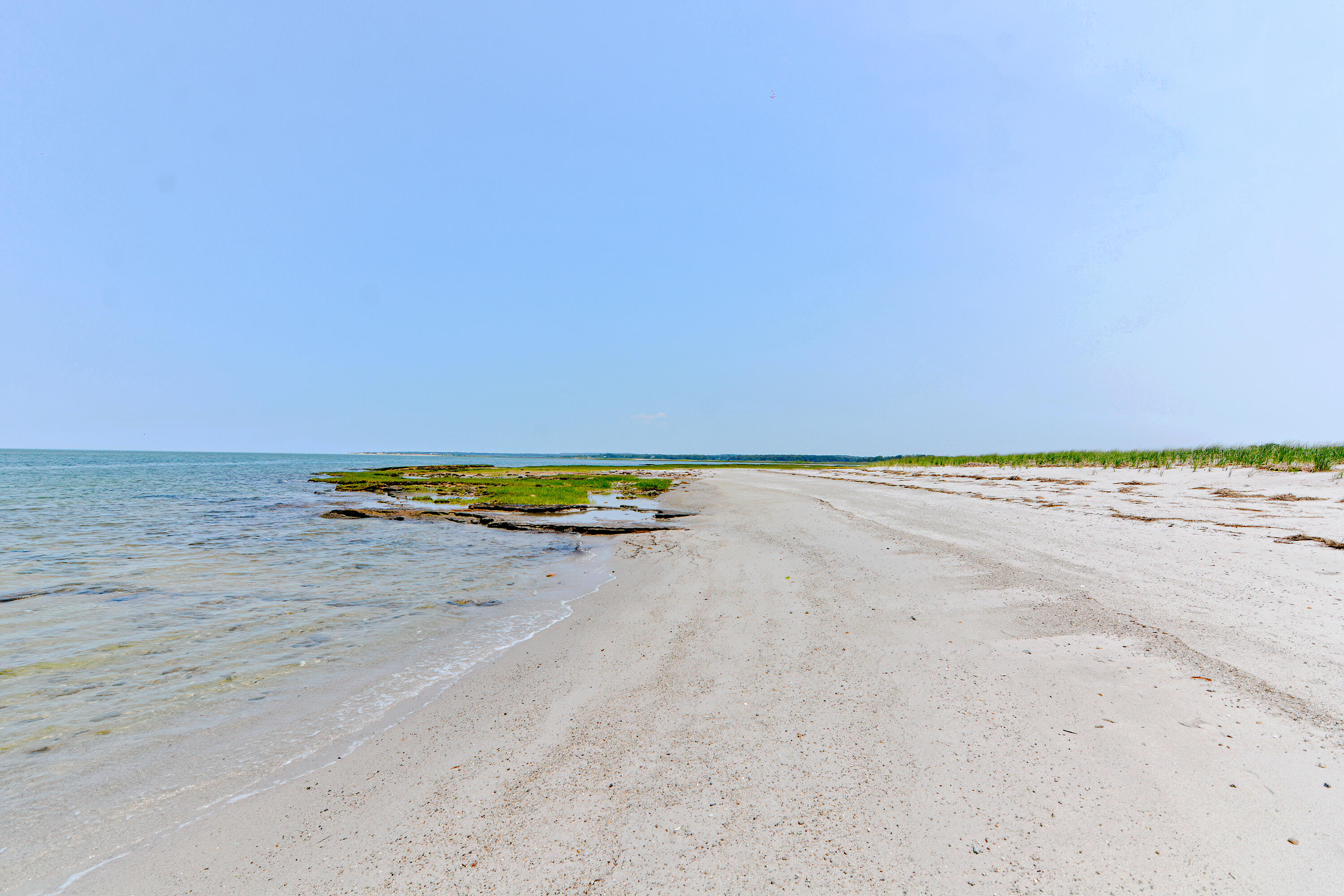 279 Harbor Point Road, Unit 12 Cummaquid, MA 02675 - Photo 23 of 35 a view of a lake and a beach