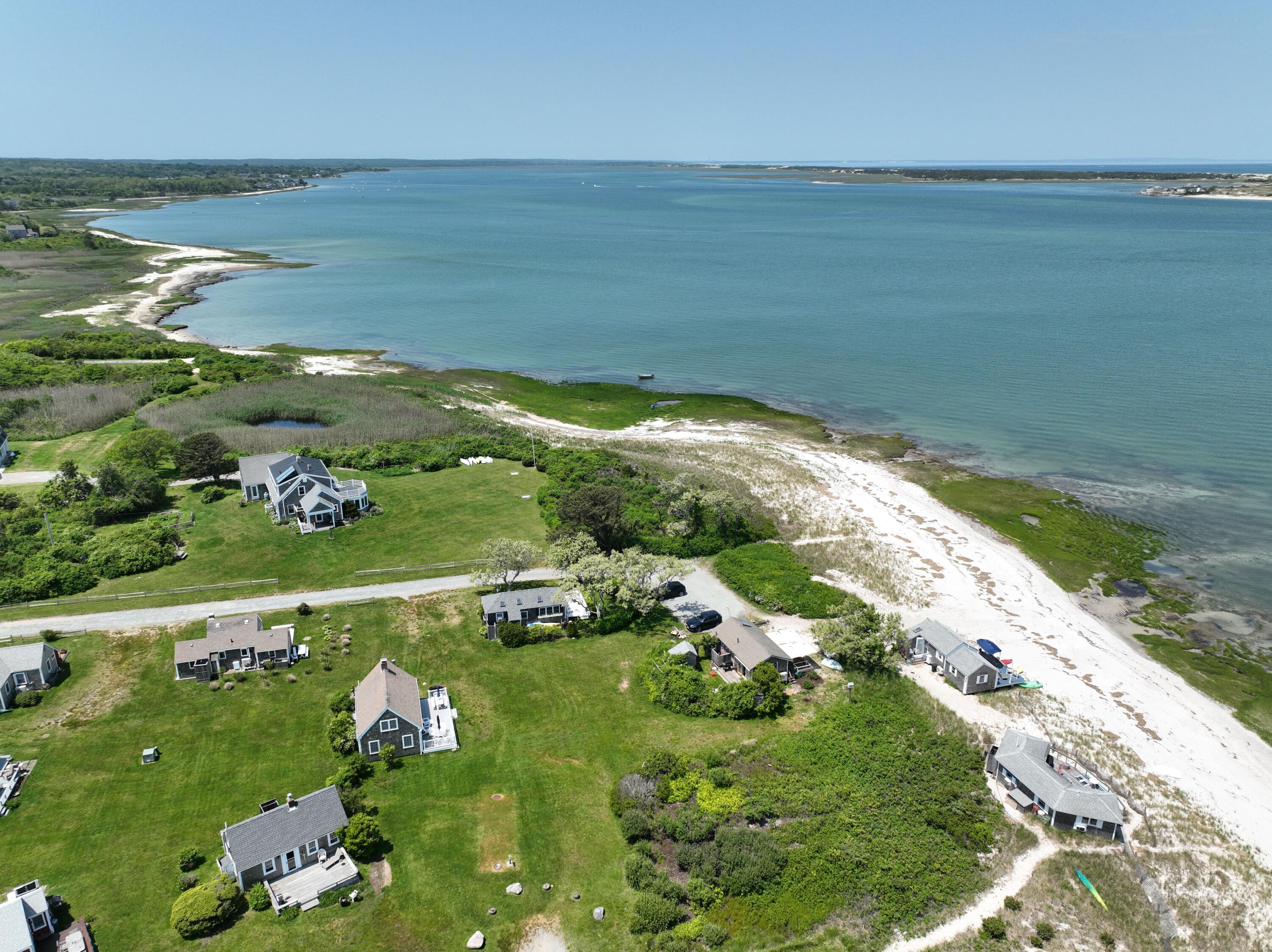 279 Harbor Point Road, Unit 12 Cummaquid, MA 02675 - Photo 32 of 35 a view of a lake with a houses