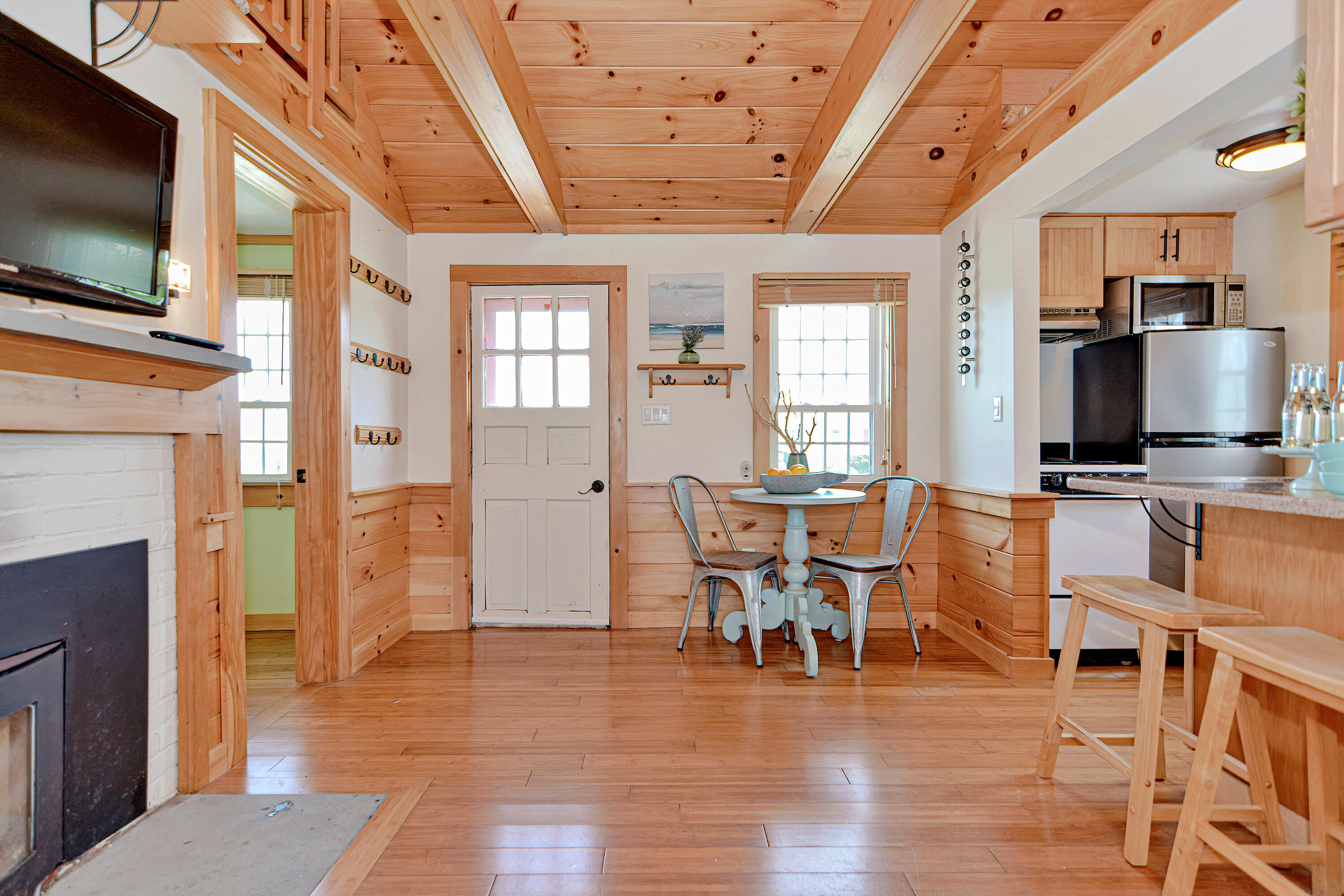 279 Harbor Point Road, Unit 12 Cummaquid, MA 02675 - Photo 7 of 35 a view of a dining room with furniture window and wooden floor