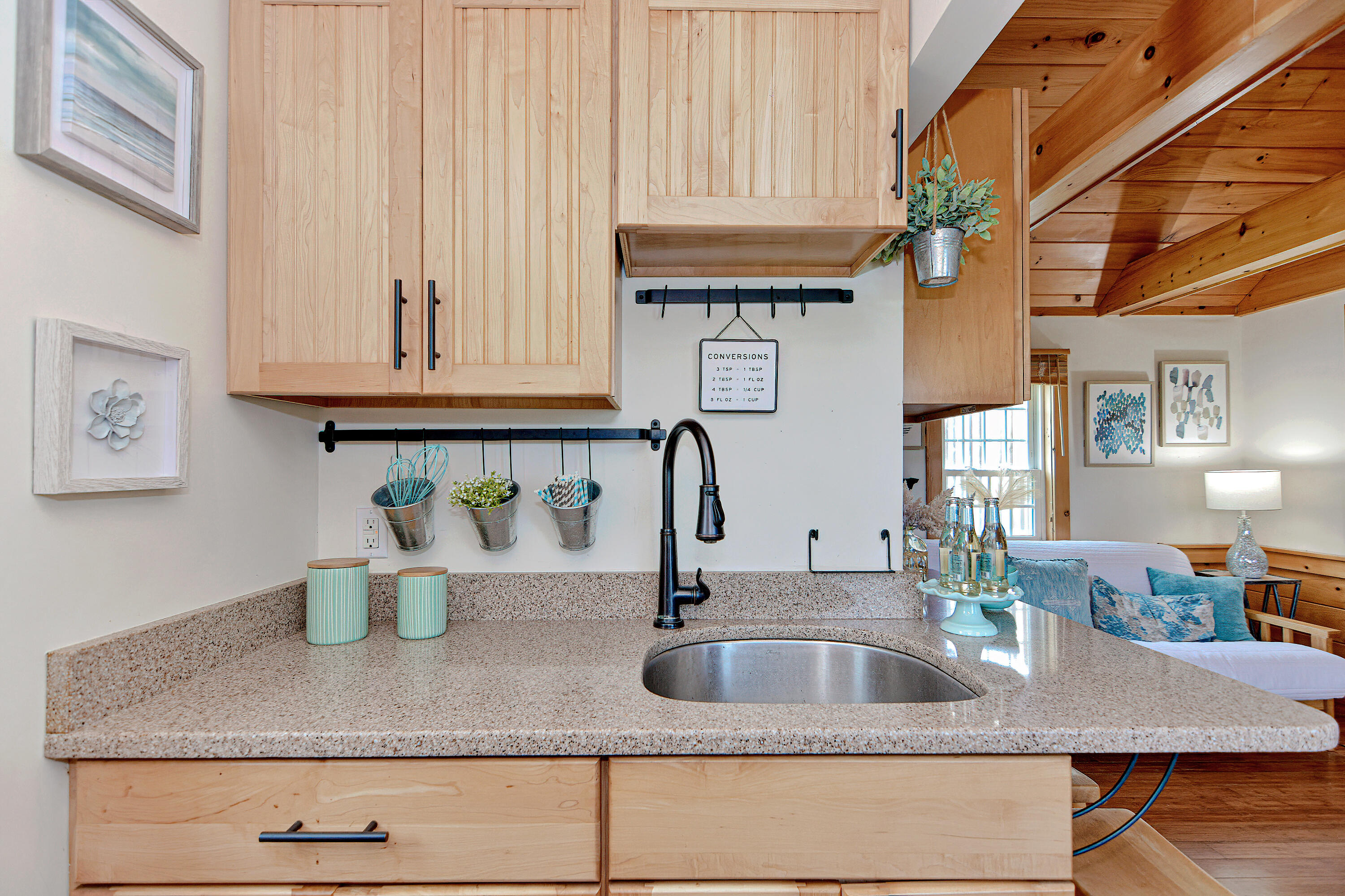 279 Harbor Point Road, Unit 12 Cummaquid, MA 02675 - Photo 10 of 35 a kitchen with a sink and cabinets