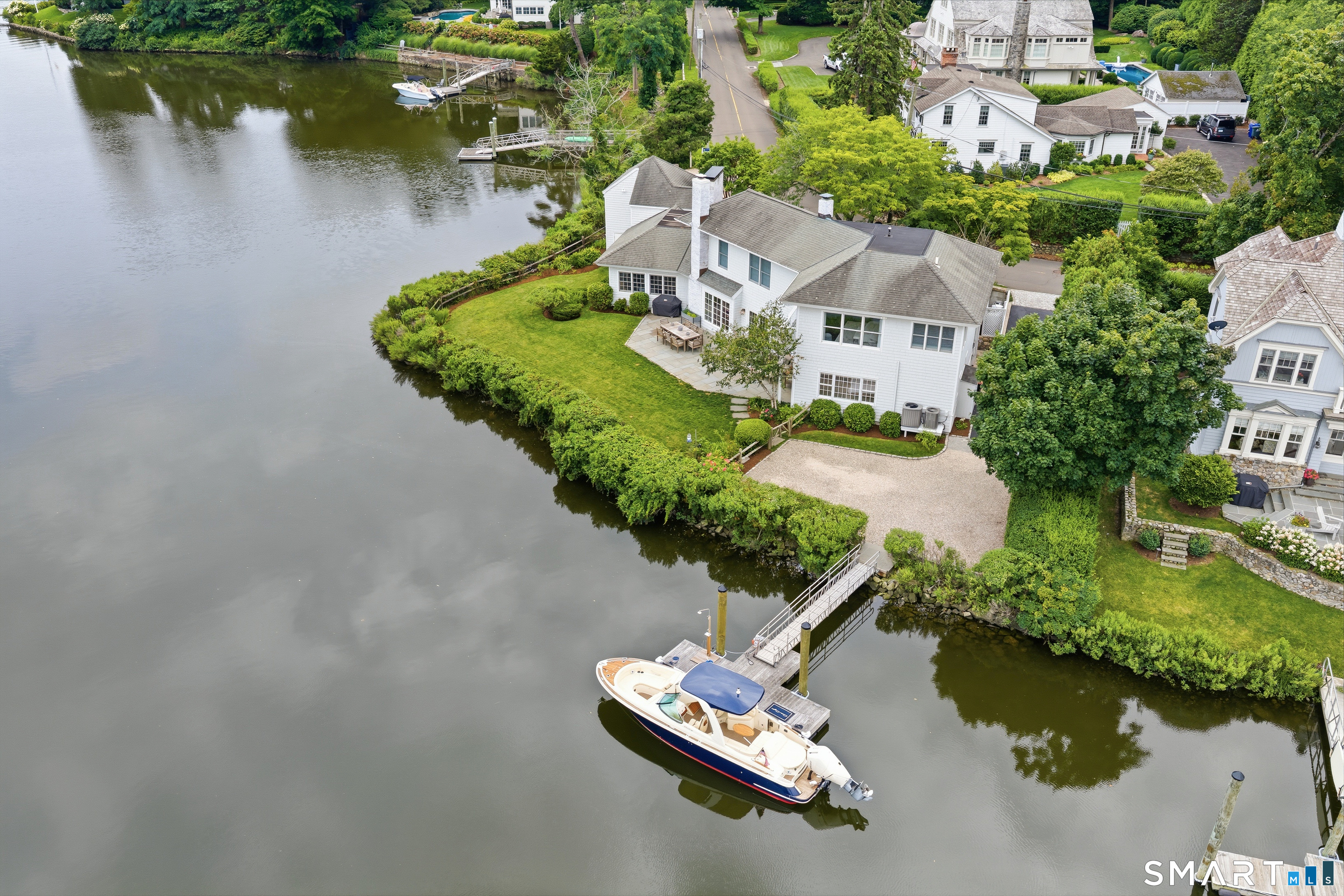 61 5 Mile River Road Darien, CT 06820 - Photo 1 of 38 All-tide dock and backyard - the perfect environment for outdoor living and entertaining