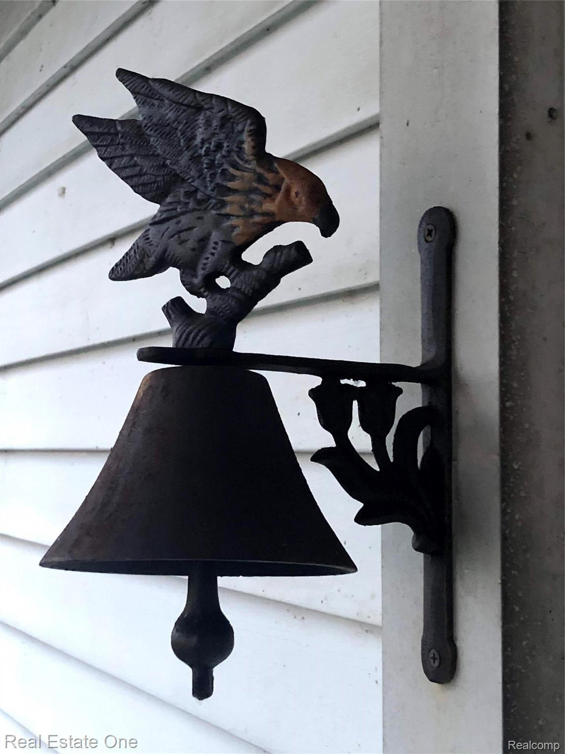 235 Millville Road Lapeer, MI 48446 - Photo 47 of 48 Unique details throughout this beautiful original farmhouse, such as this dinner bell.